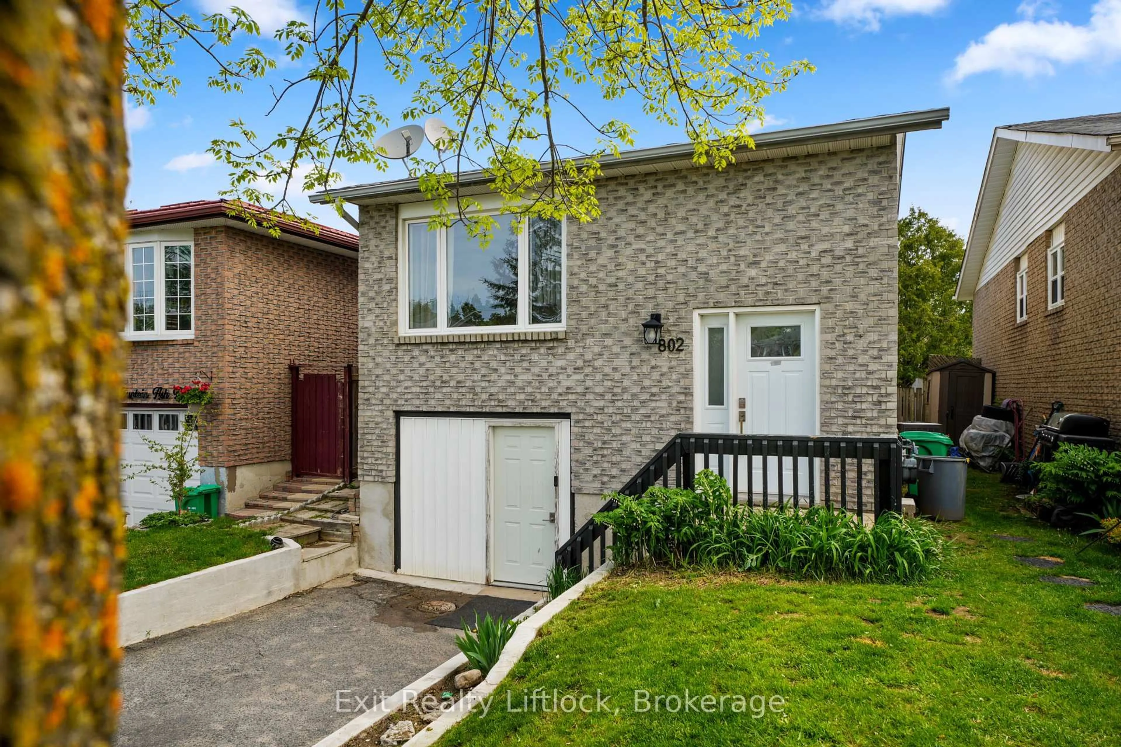 Home with brick exterior material, street for 802 Mountain Ash Rd, Peterborough Ontario K9J 8K2