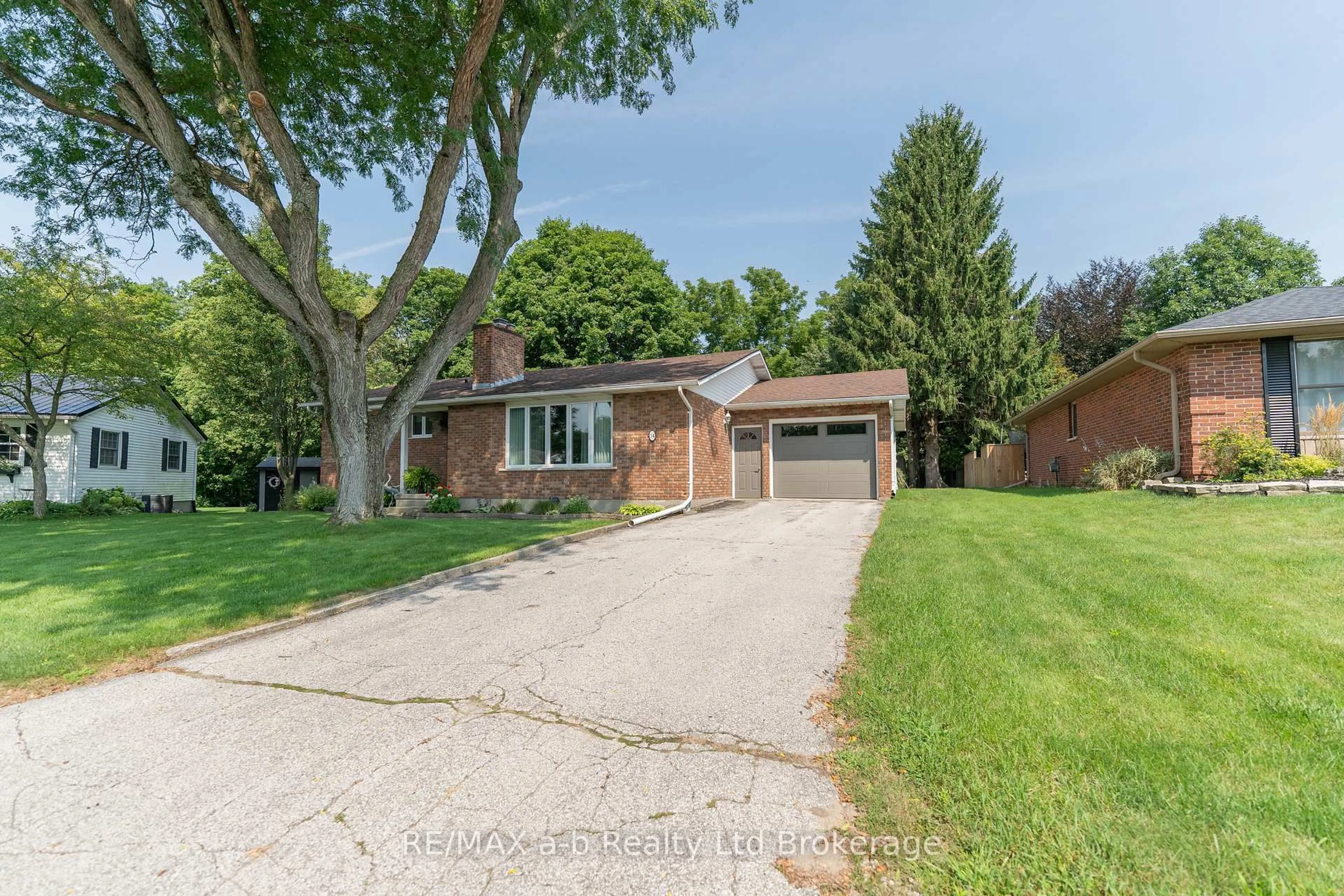 Home with brick exterior material, street for 34 Glenridge Rd, Tillsonburg Ontario N4G 4J7