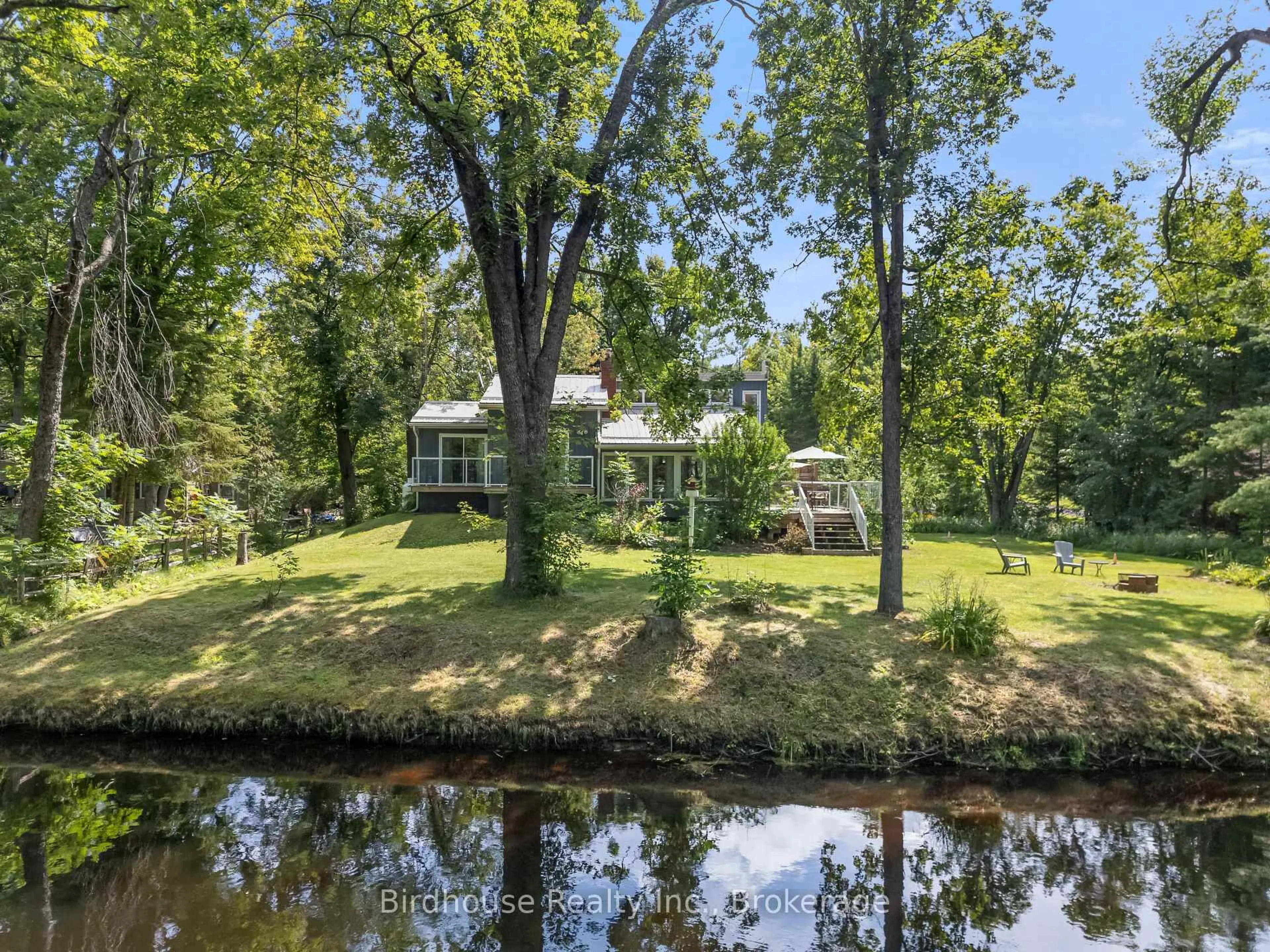 A pic from outside/outdoor area/front of a property/back of a property/a pic from drone, water/lake/river/ocean view for 92 Edwina Dr, Trent Lakes Ontario K0M 1A0