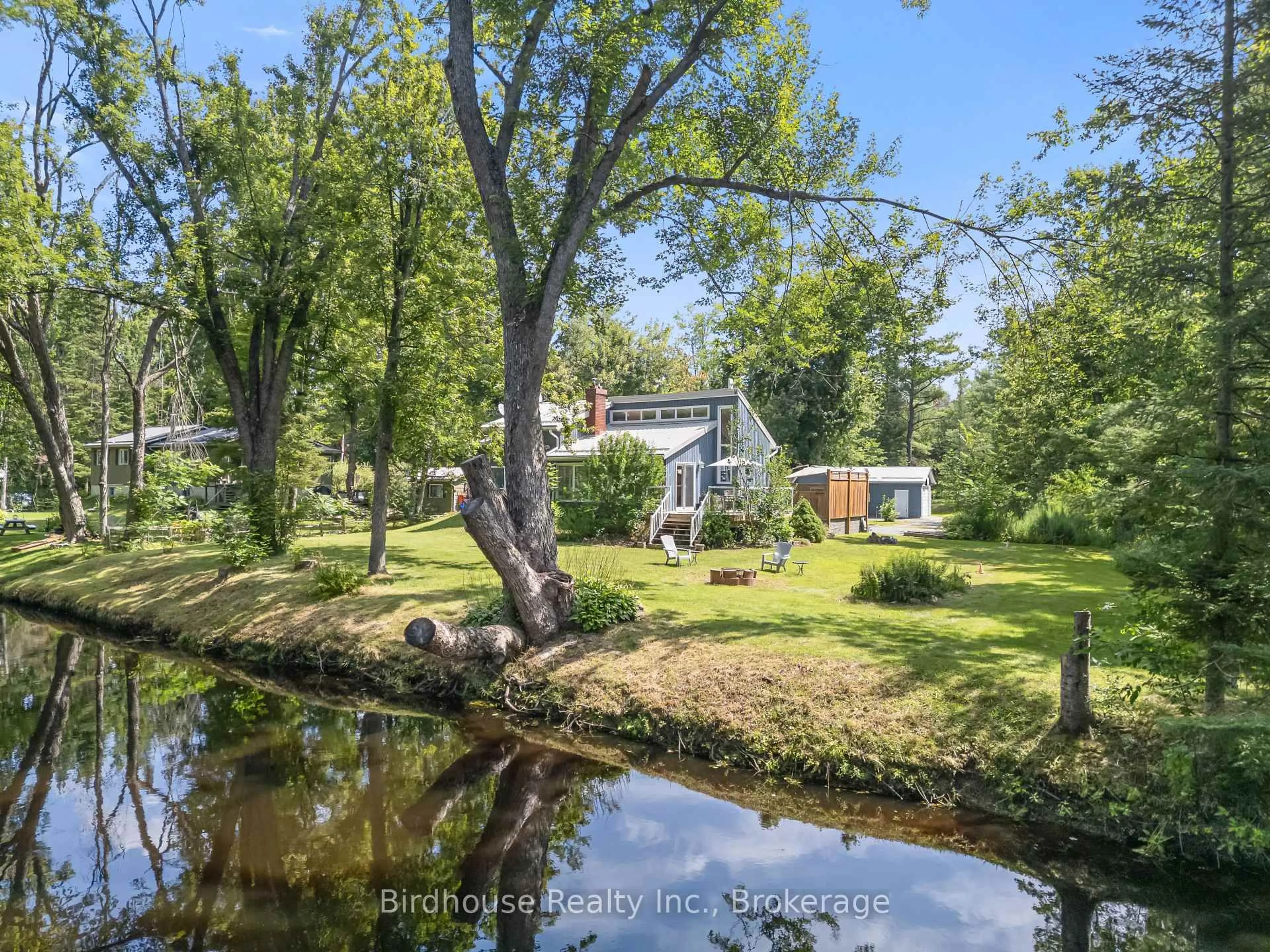 A pic from outside/outdoor area/front of a property/back of a property/a pic from drone, water/lake/river/ocean view for 92 Edwina Dr, Trent Lakes Ontario K0M 1A0