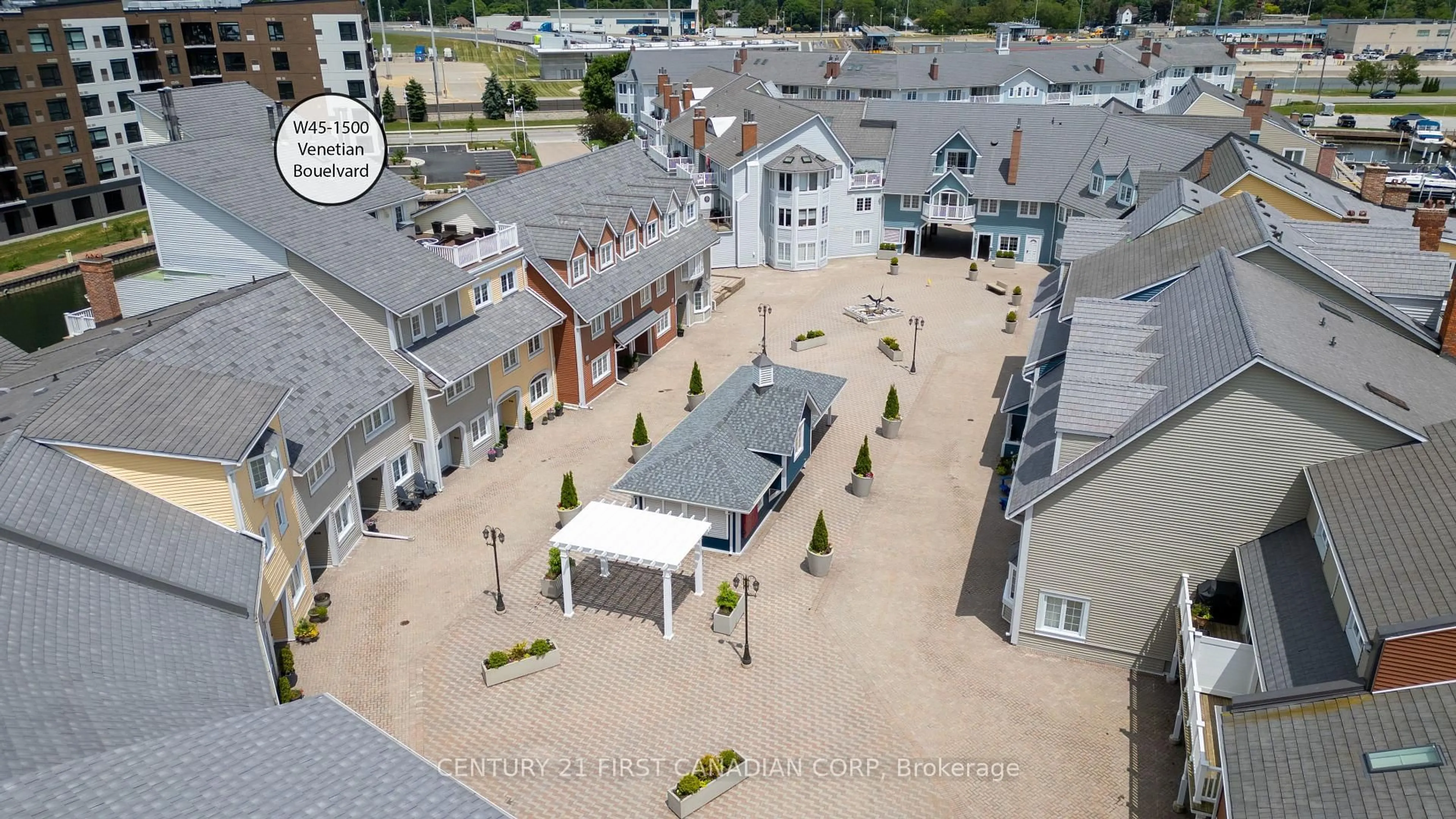 A pic from outside/outdoor area/front of a property/back of a property/a pic from drone, street for 1500 Venetian Blvd #W45, Point Edward Ontario N7T 7W4