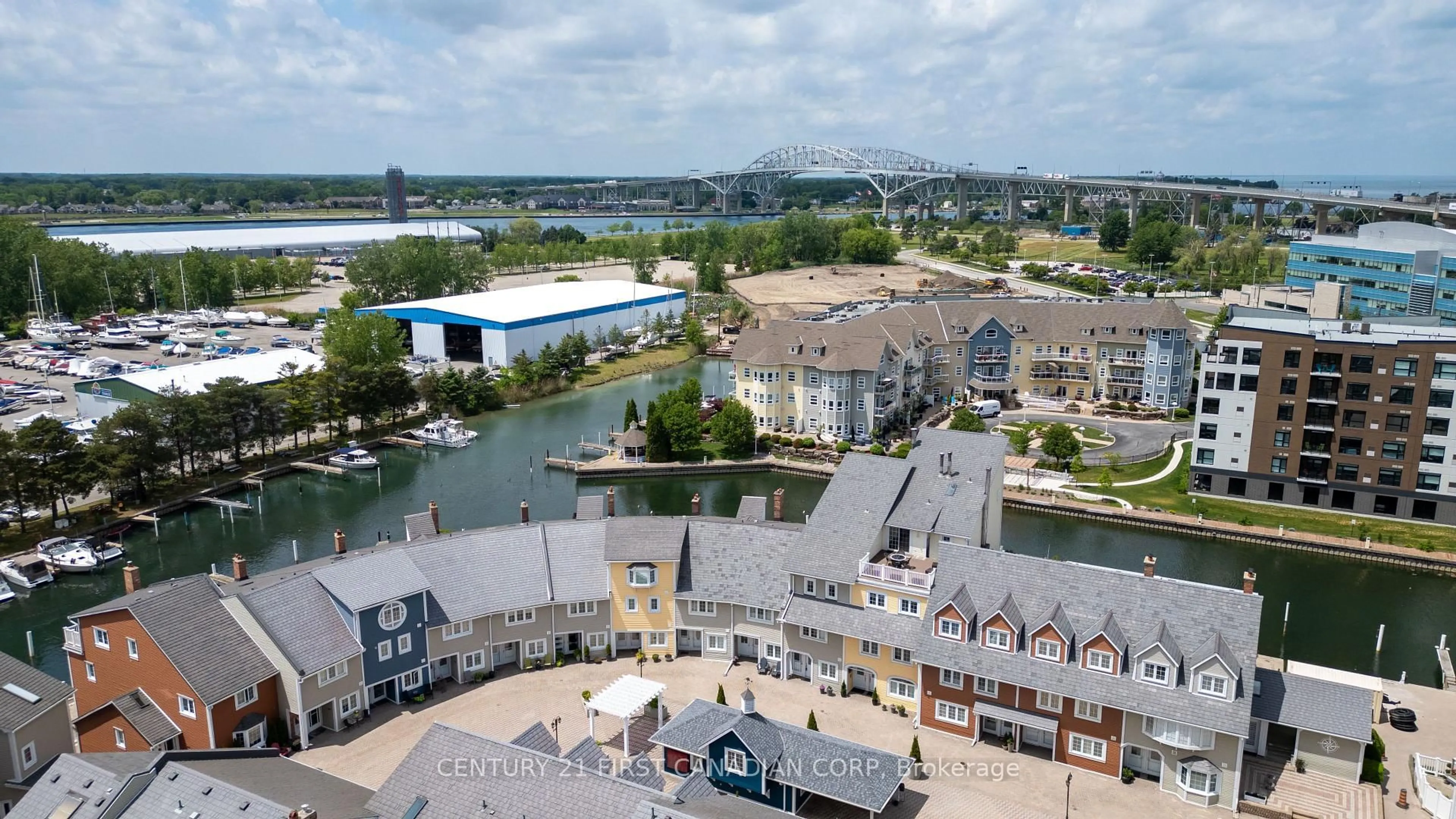 A pic from outside/outdoor area/front of a property/back of a property/a pic from drone, water/lake/river/ocean view for 1500 Venetian Blvd #W45, Point Edward Ontario N7T 7W4