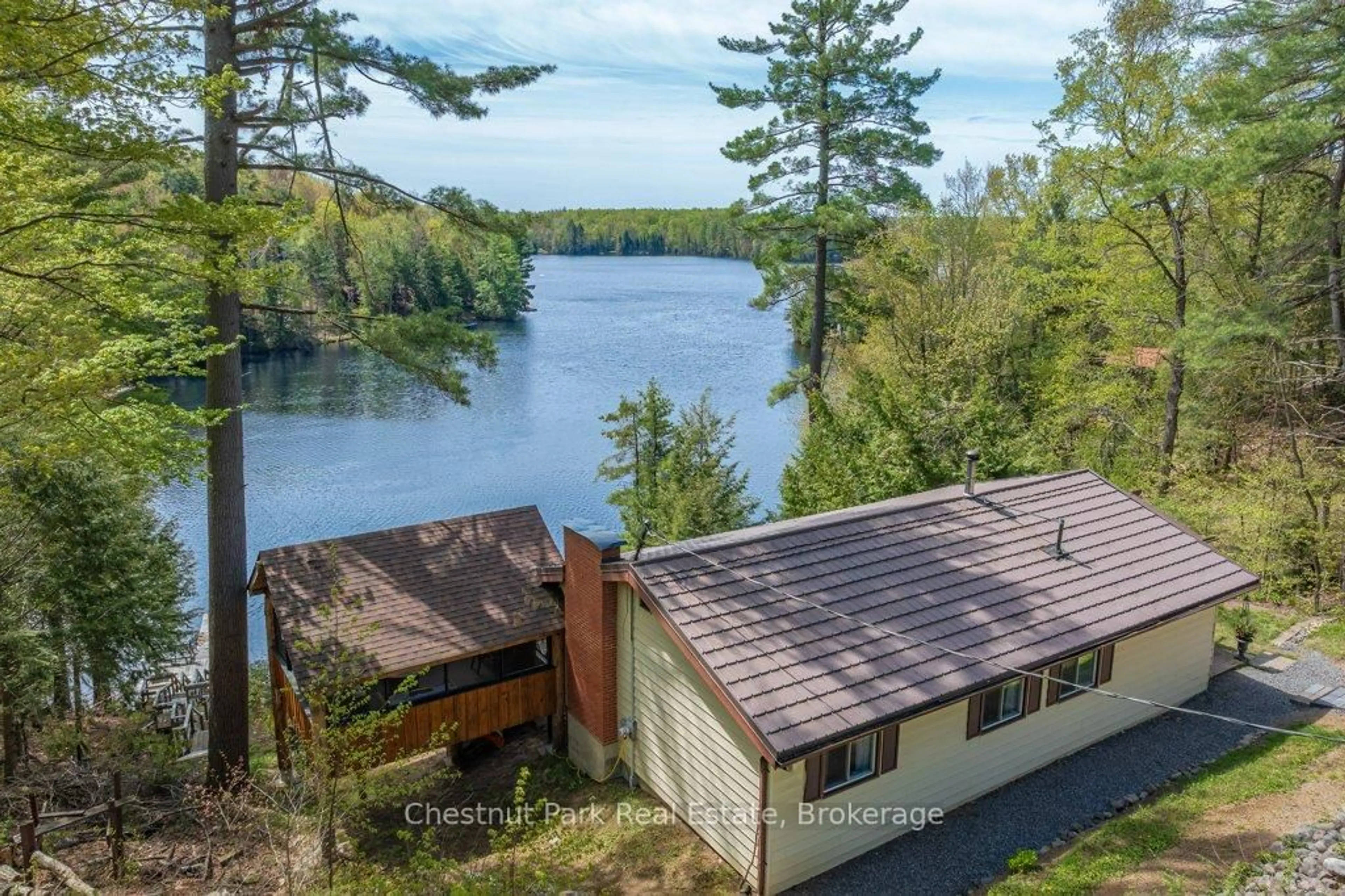 A pic from outside/outdoor area/front of a property/back of a property/a pic from drone, water/lake/river/ocean view for 1026 Carlson Pl, Bracebridge Ontario P1L 1X1