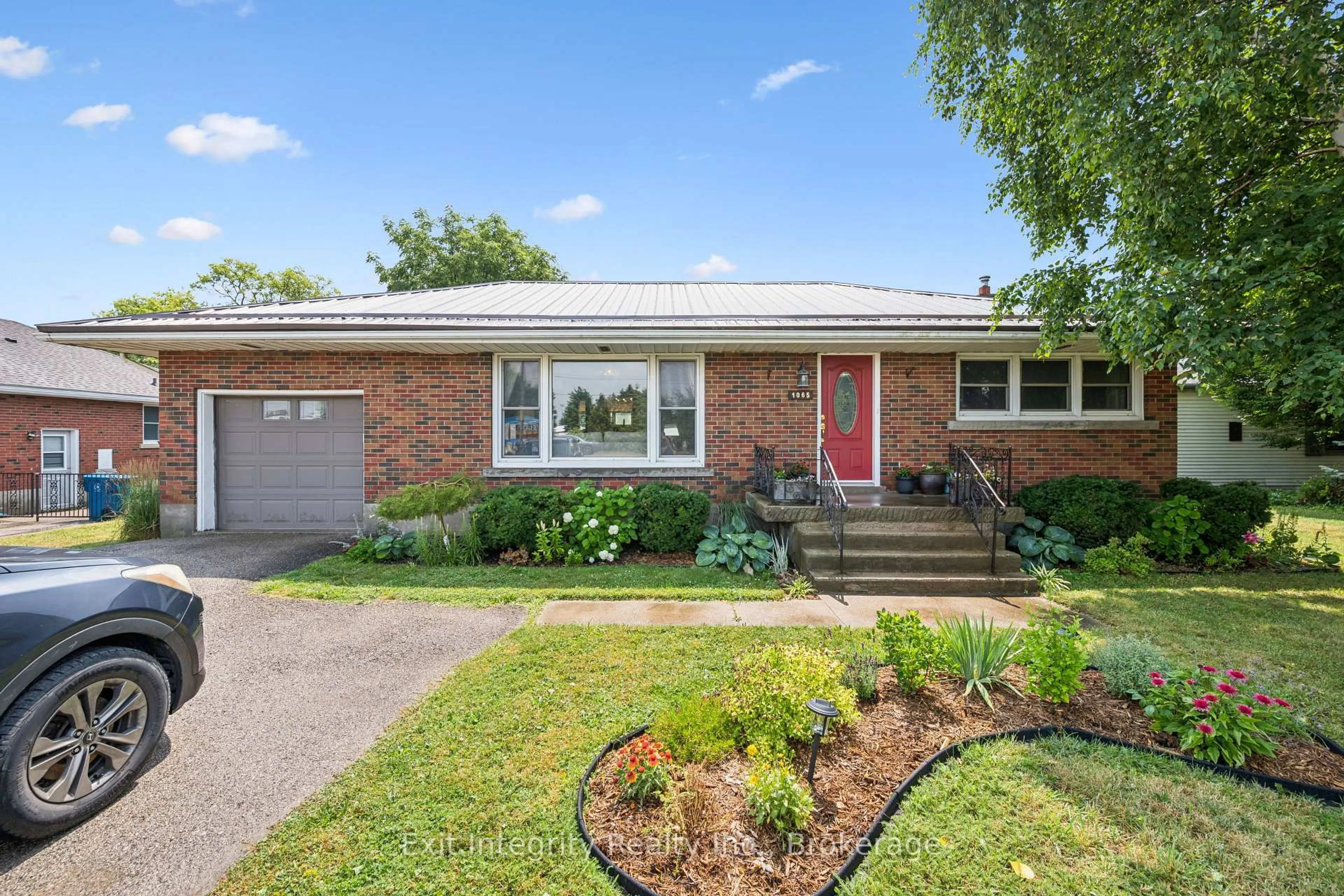 Home with brick exterior material, street for 1065 Erie St, Stratford Ontario N5A 6S4