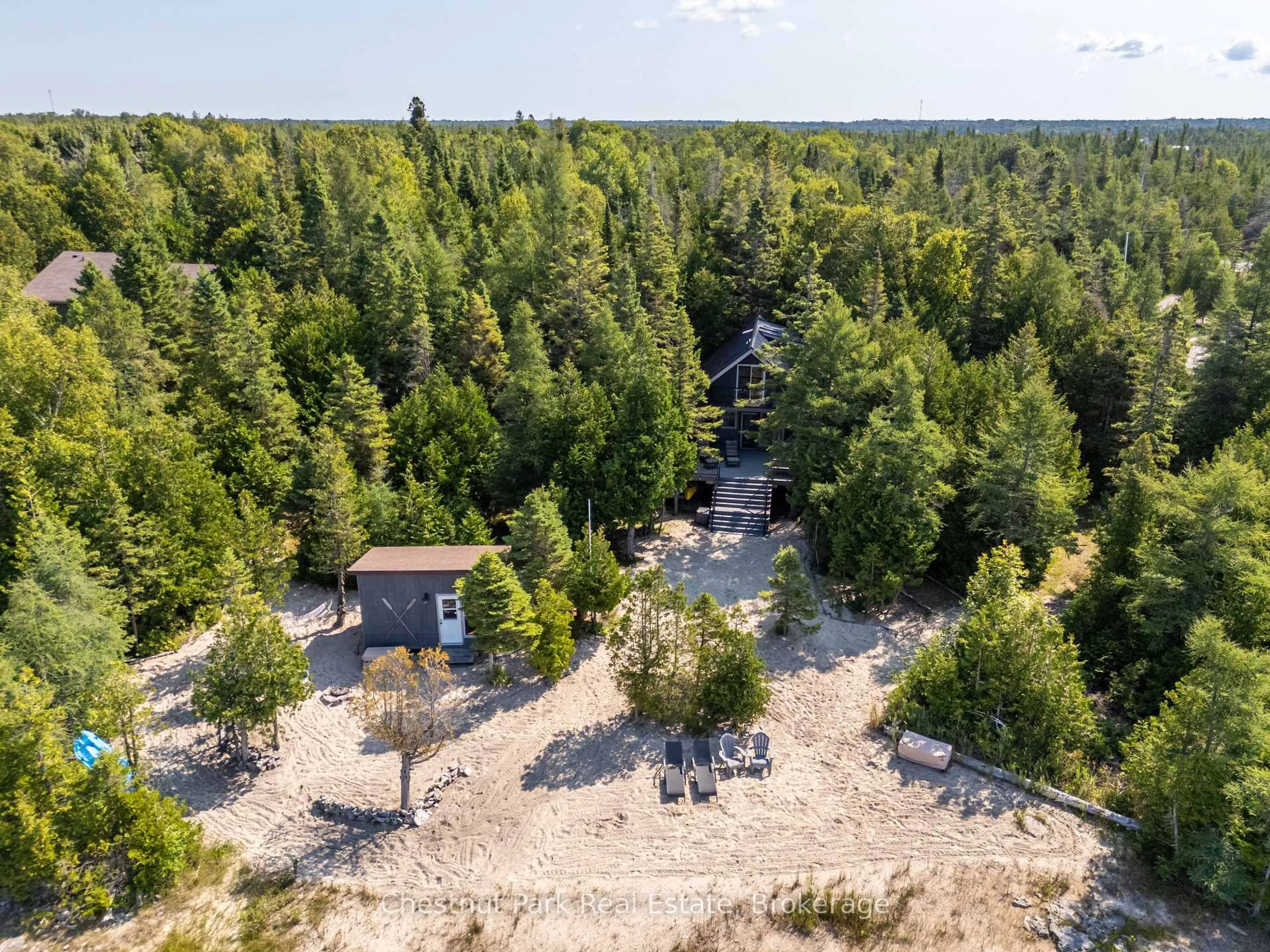 A pic from outside/outdoor area/front of a property/back of a property/a pic from drone, forest/trees view for 100 Forbes Rd, Northern Bruce Peninsula Ontario N0H 2T0