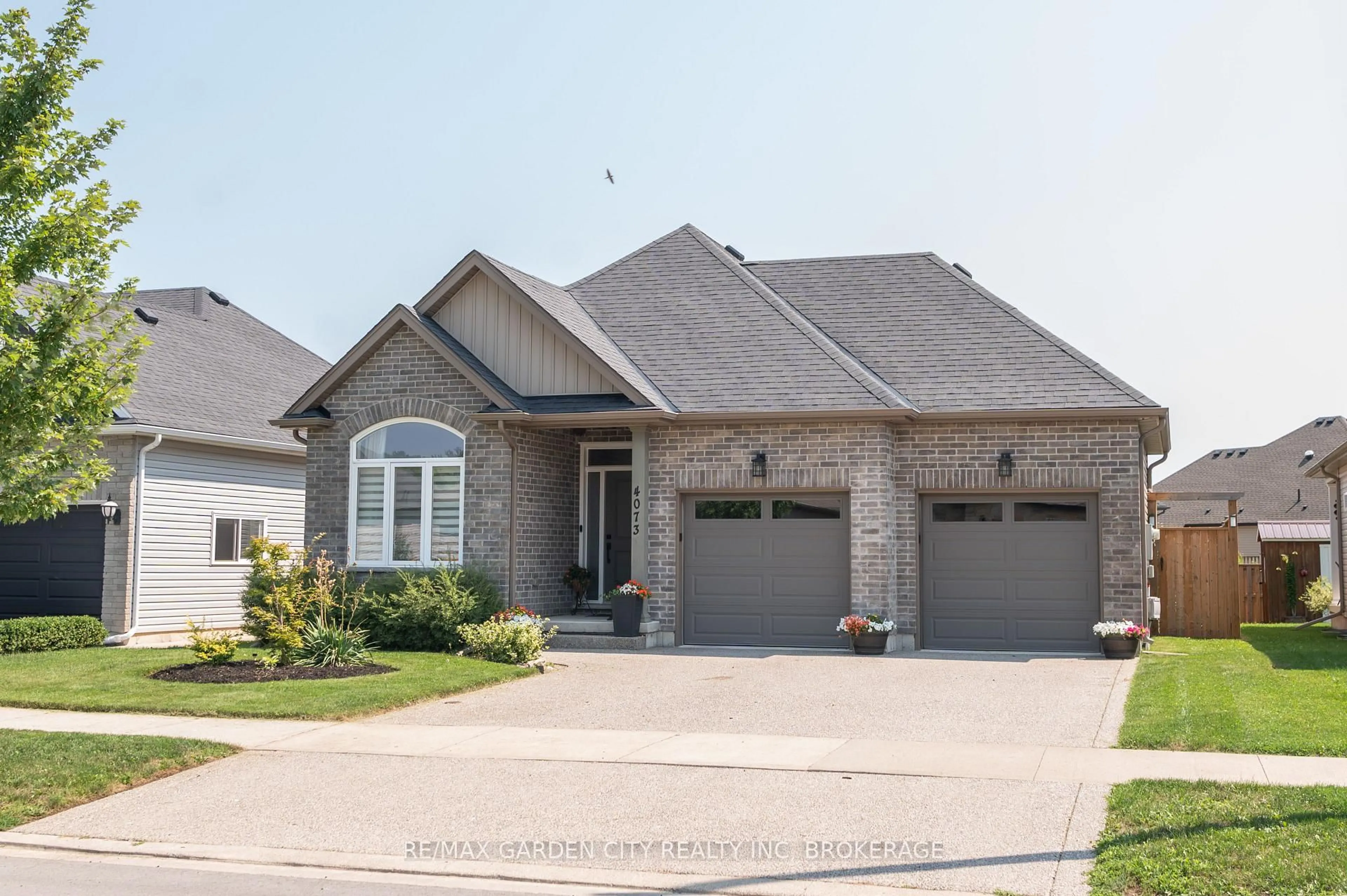 Home with brick exterior material, street for 4073 Village Creek Dr, Fort Erie Ontario L0S 1S0