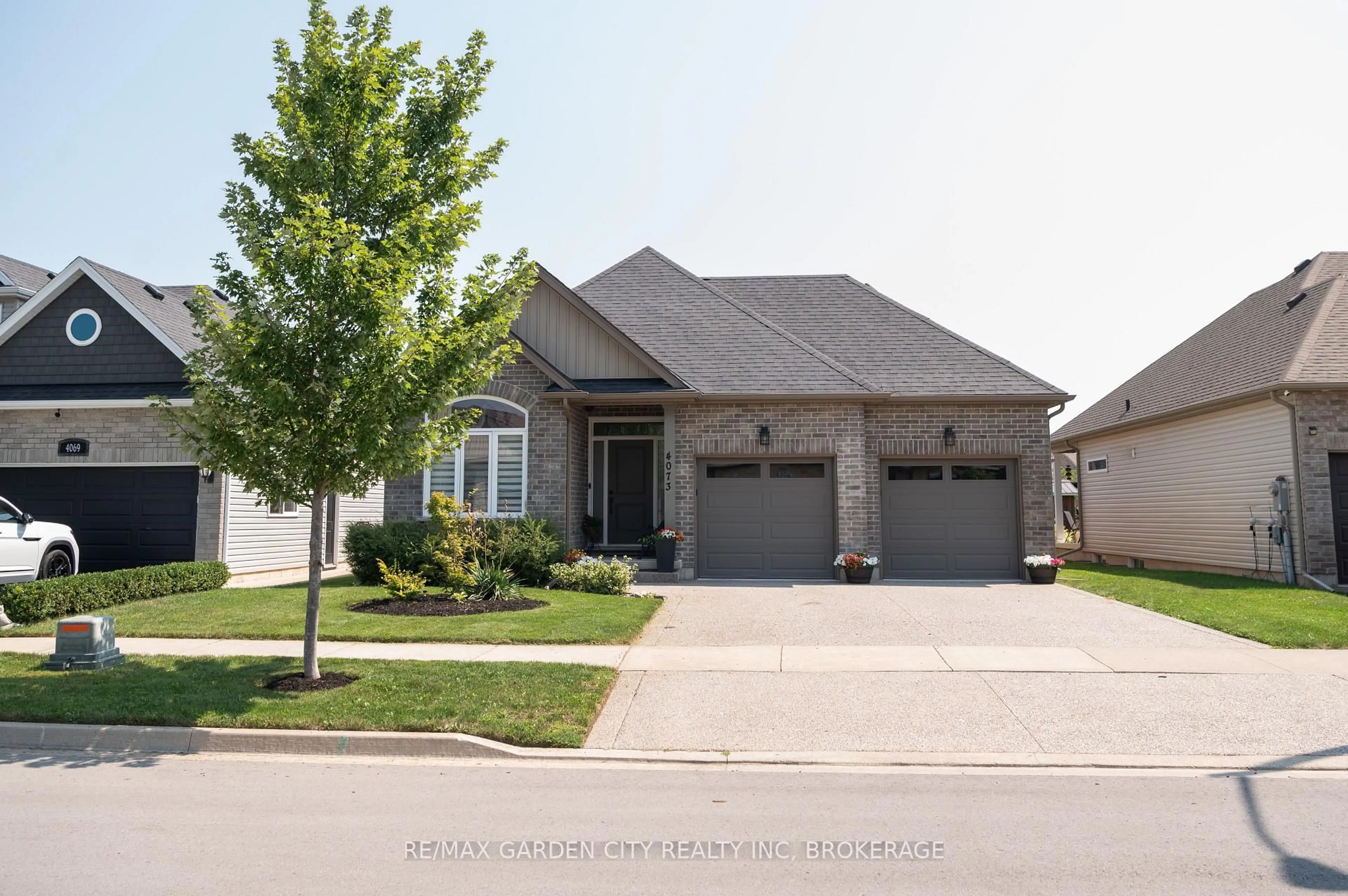 Home with brick exterior material, street for 4073 Village Creek Dr, Fort Erie Ontario L0S 1S0