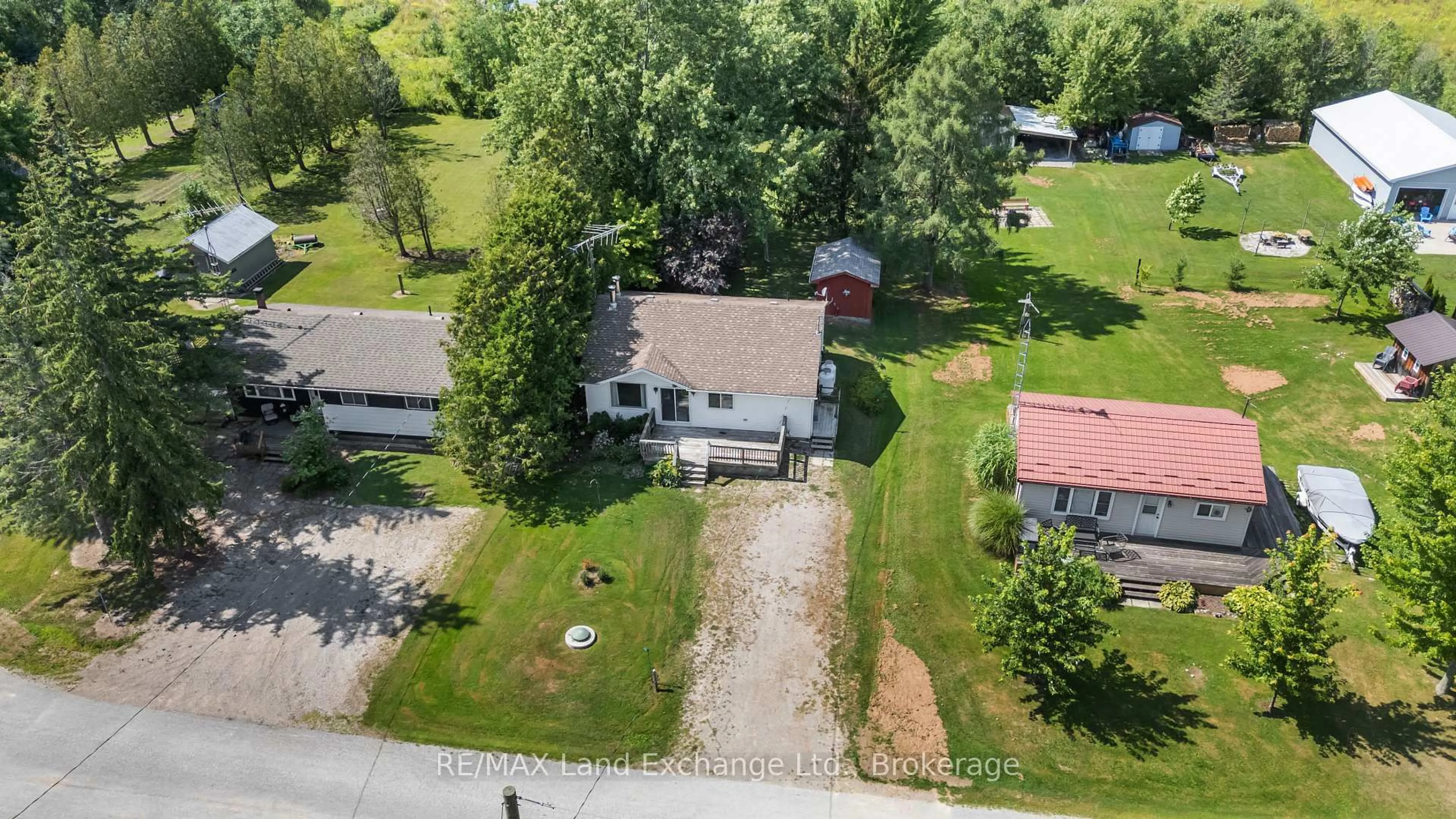 A pic from outside/outdoor area/front of a property/back of a property/a pic from drone, unknown for 46 Lilac Lane, South Bruce Peninsula Ontario N0H 1A0