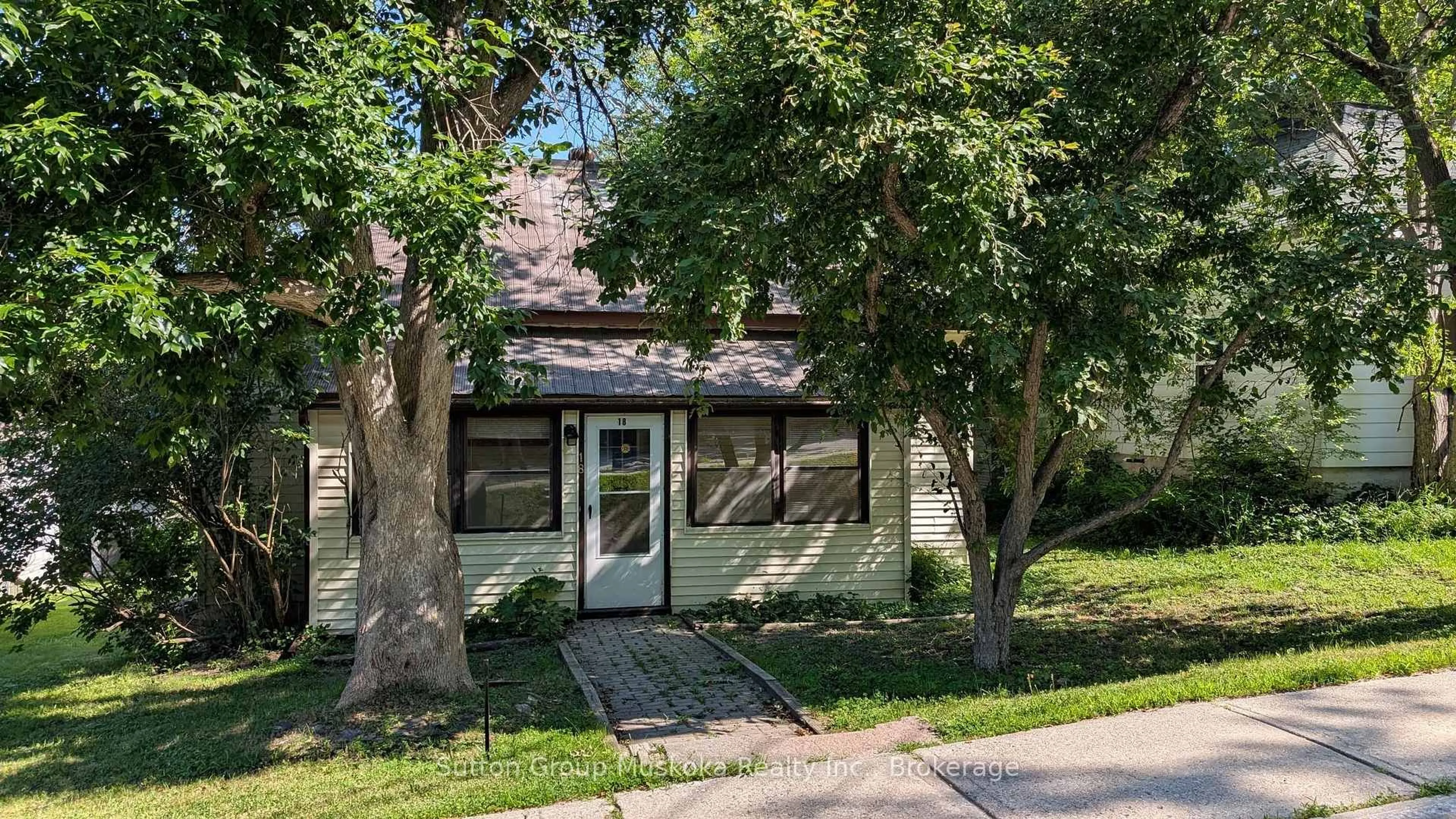 Home with brick exterior material, street for 18 Susan St, Huntsville Ontario P1H 1X4