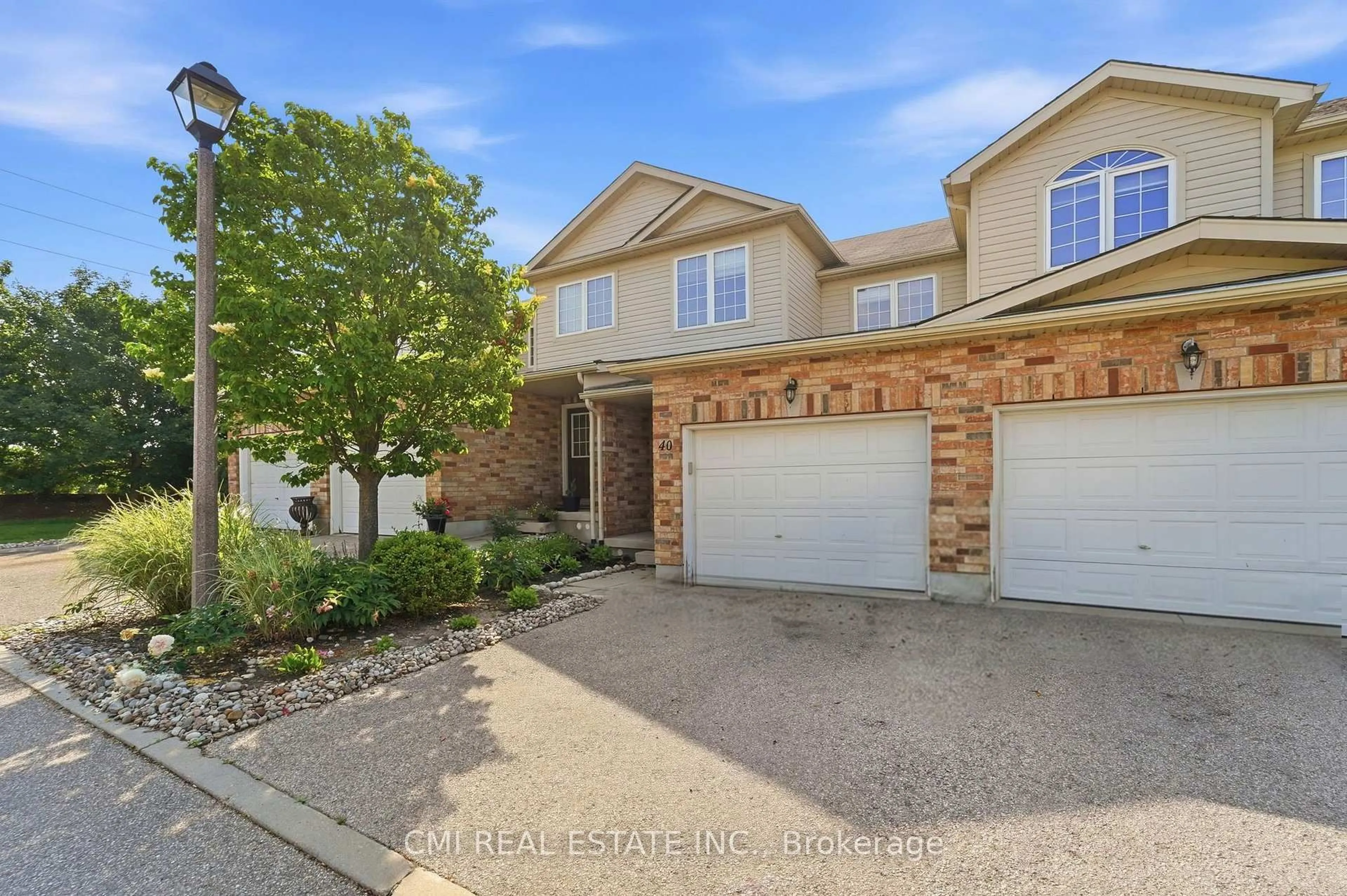 A pic from outside/outdoor area/front of a property/back of a property/a pic from drone, street for 105 Bard Blvd #40, Guelph Ontario N1L 0E2