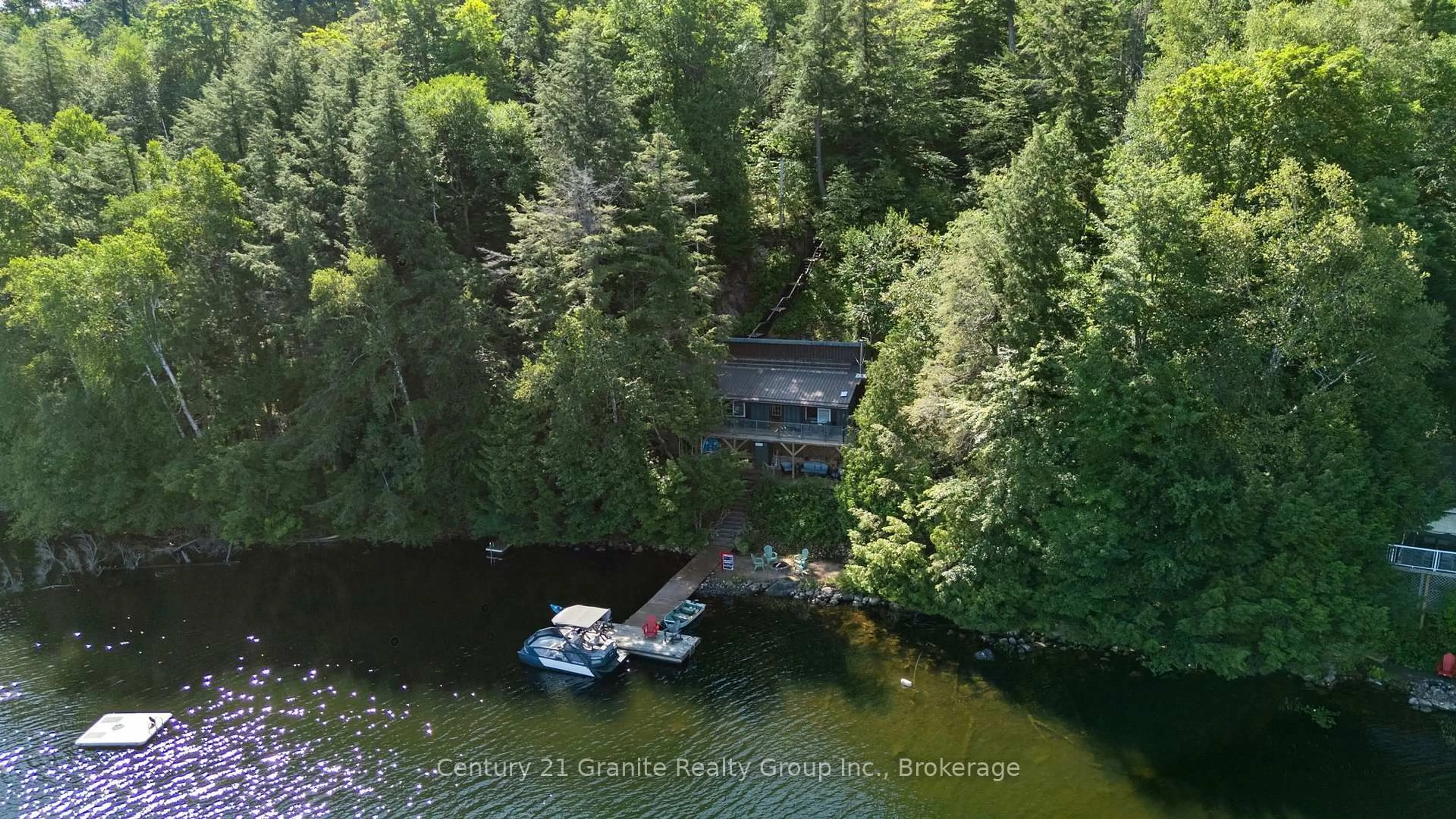 A pic from outside/outdoor area/front of a property/back of a property/a pic from drone, water/lake/river/ocean view for 1411 Tock Lane, Algonquin Highlands Ontario P0A 1E0