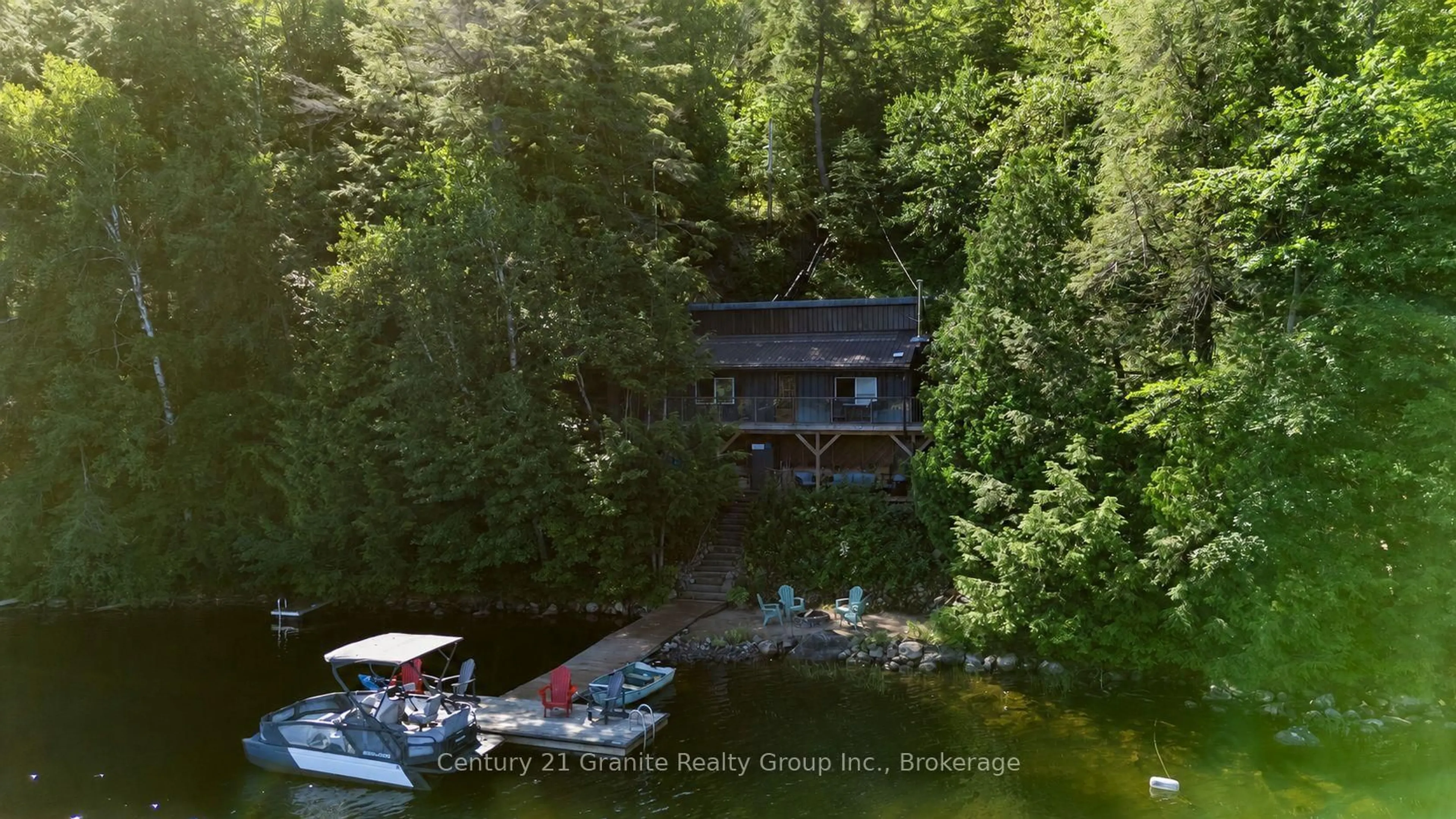 A pic from outside/outdoor area/front of a property/back of a property/a pic from drone, water/lake/river/ocean view for 1411 Tock Lane, Algonquin Highlands Ontario P0A 1E0