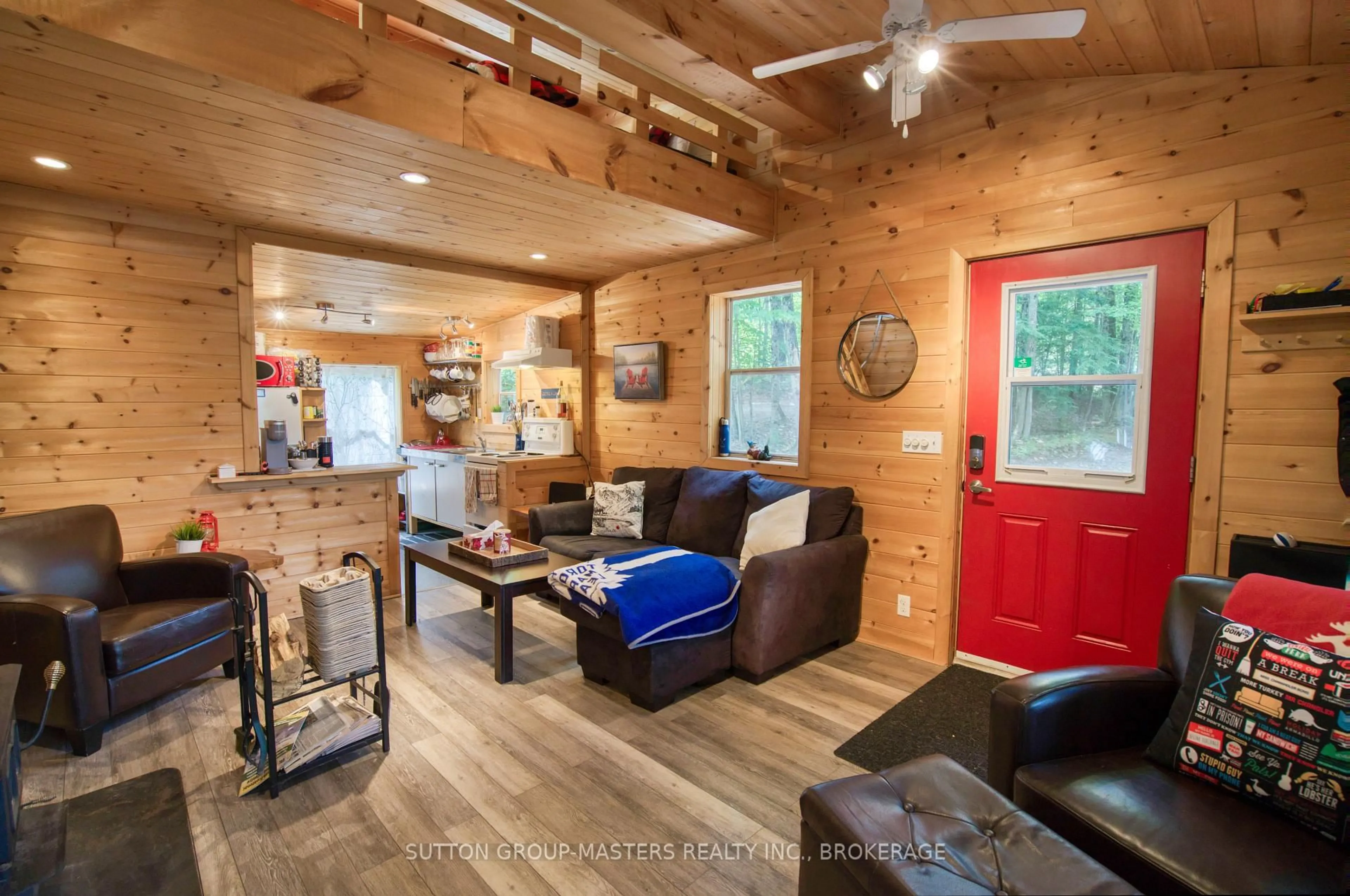 Living room with furniture, wood/laminate floor for 2282 Myers Cave Rd, Cloyne Ontario K0H 1K0