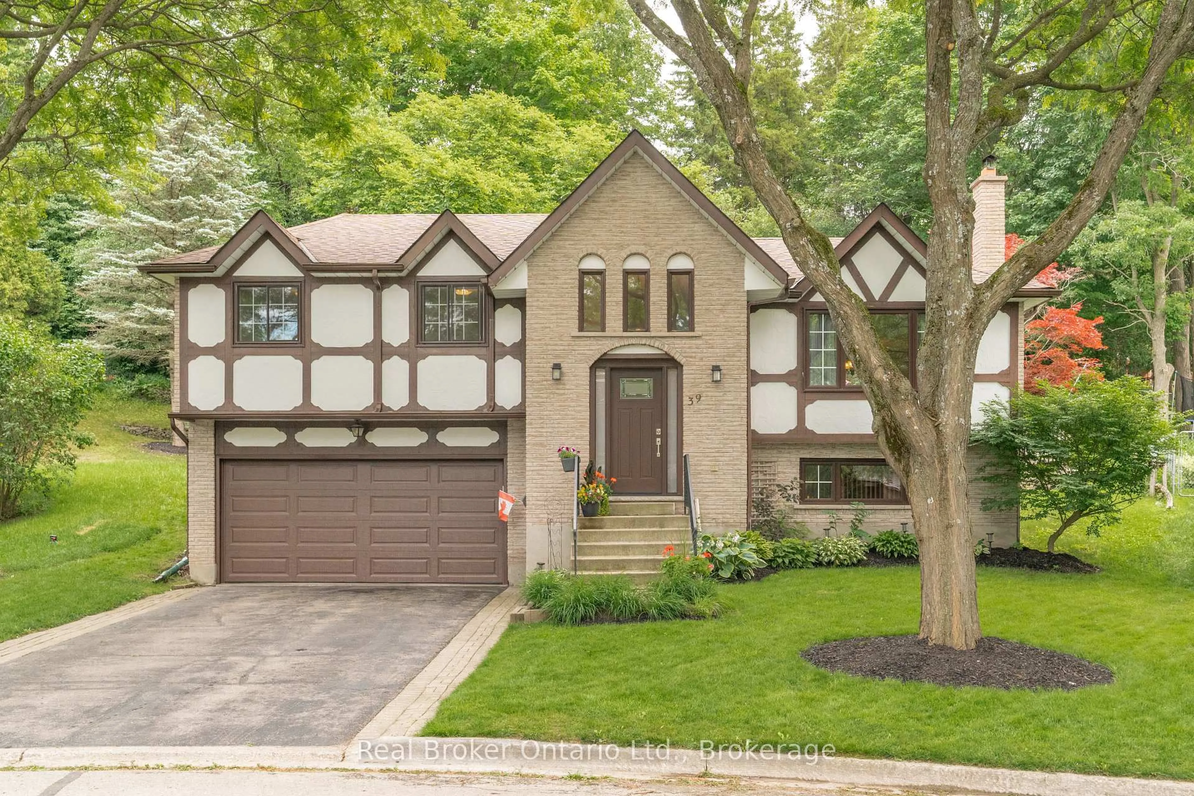 Home with brick exterior material, street for 39 Wagoners Tr, Guelph Ontario N1G 3M9