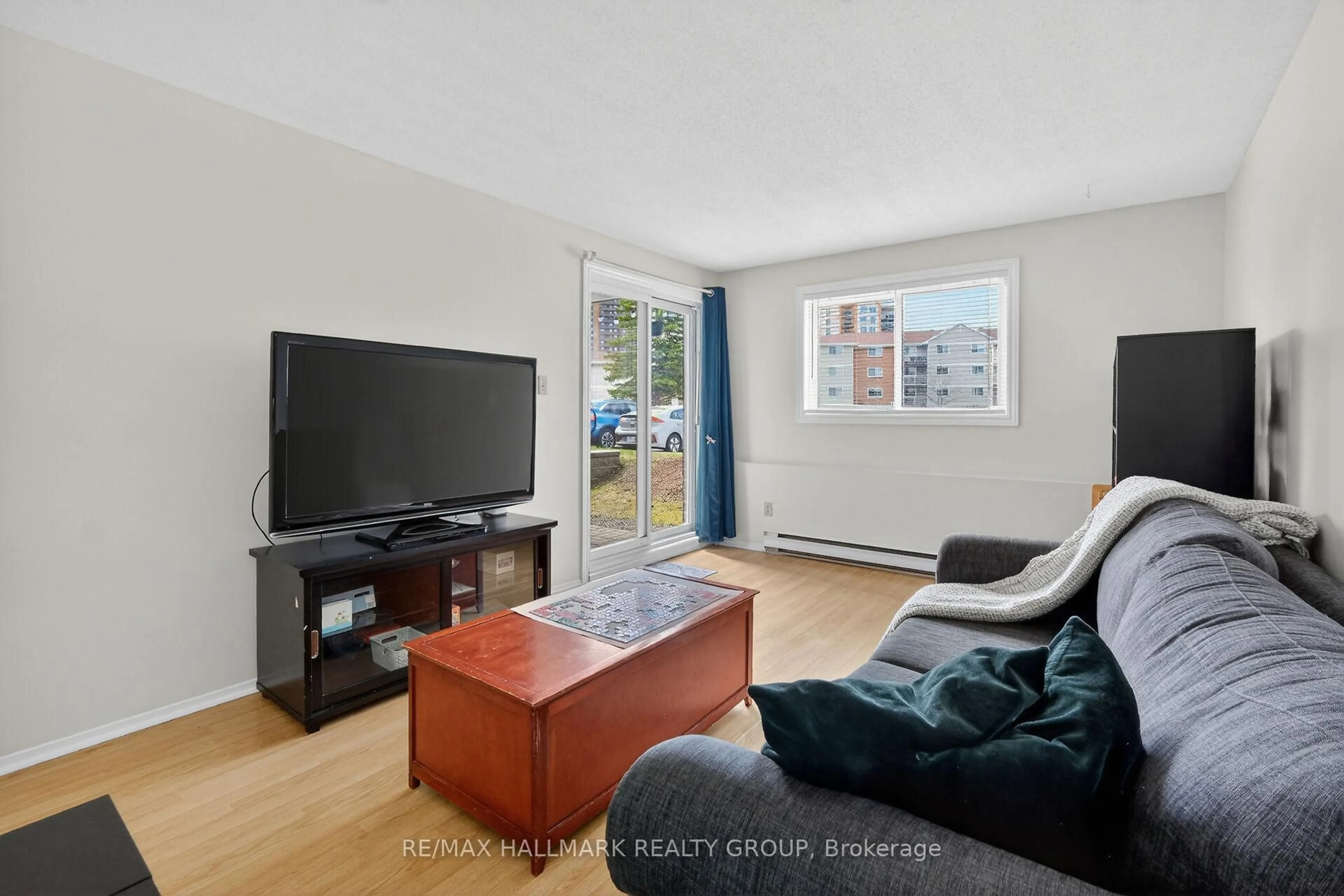 Living room with furniture, unknown for 280 Brittany Dr #102, Ottawa Ontario K1K 4M4