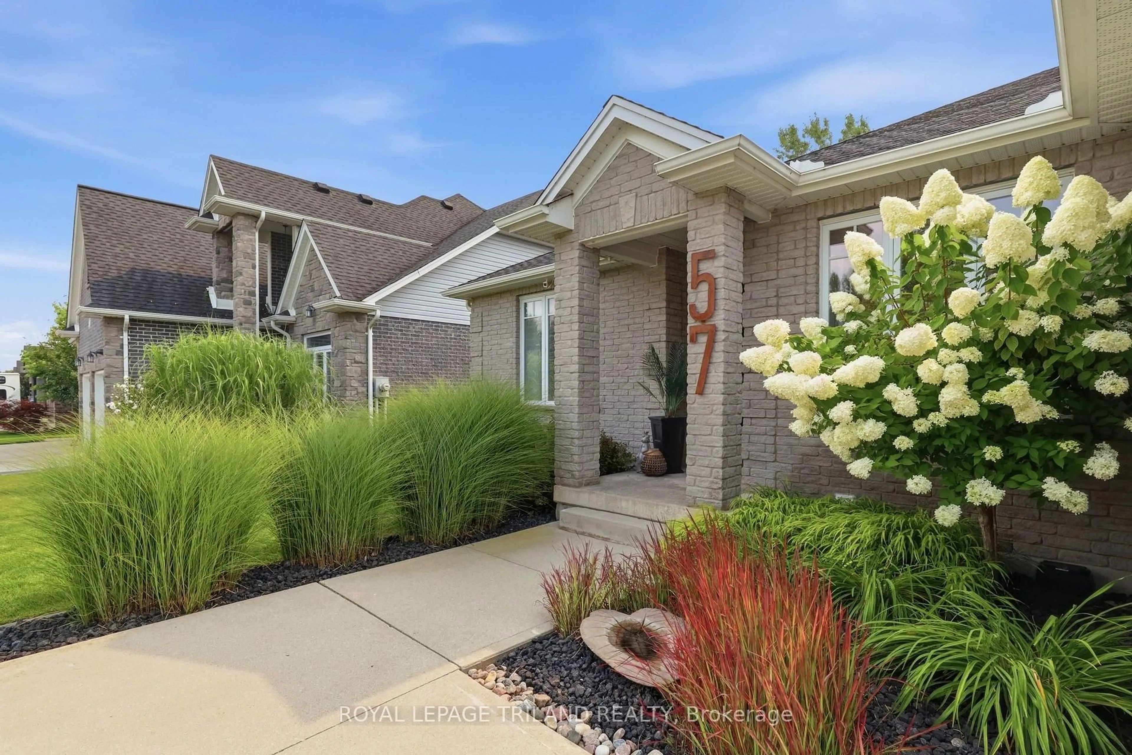 Home with brick exterior material, street for 57 Caverhill Cres, Middlesex Centre Ontario N0L 1R0