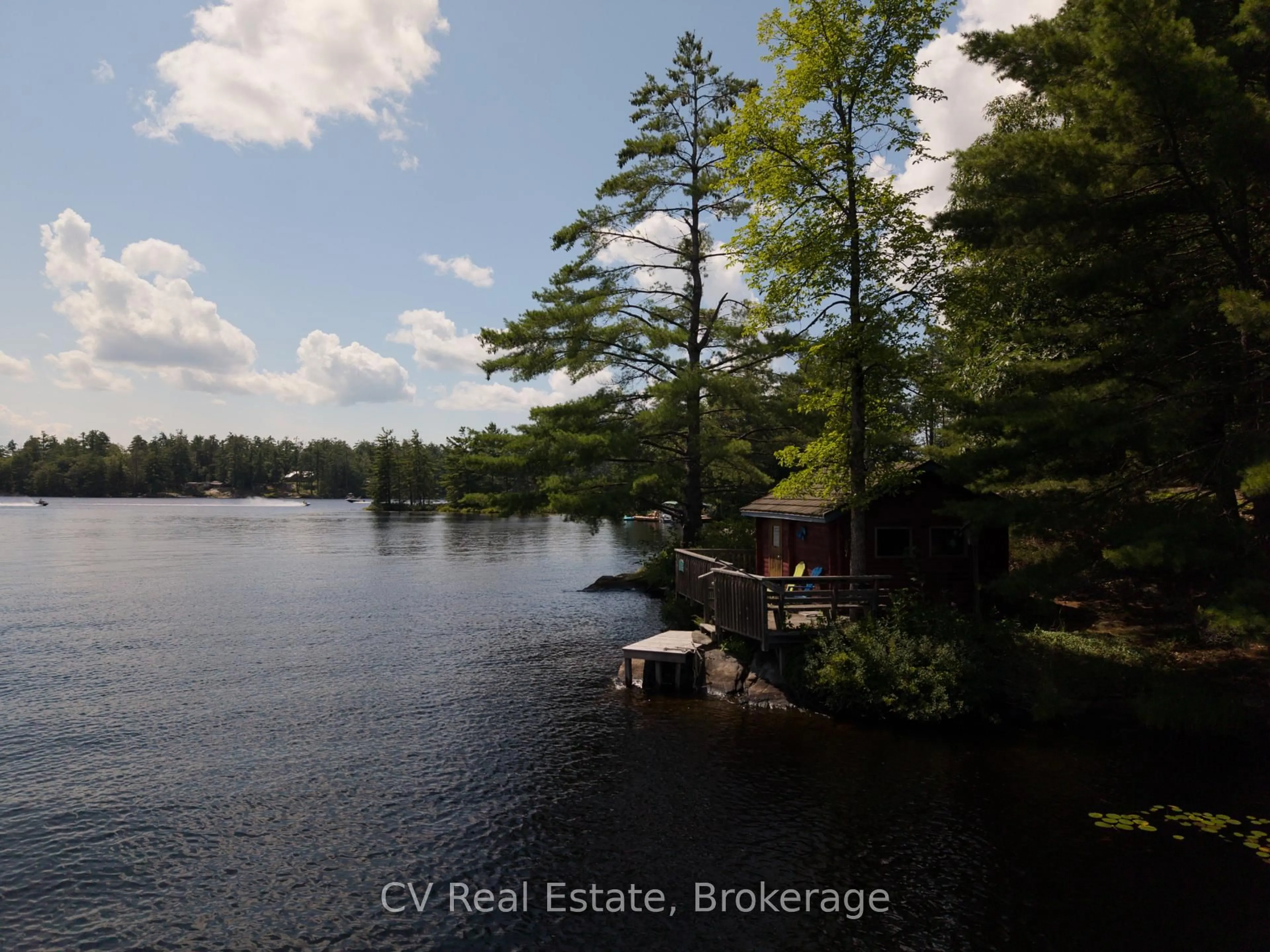 A pic from outside/outdoor area/front of a property/back of a property/a pic from drone, water/lake/river/ocean view for 1037 Sunrise Dr, Gravenhurst Ontario P1P 1R3