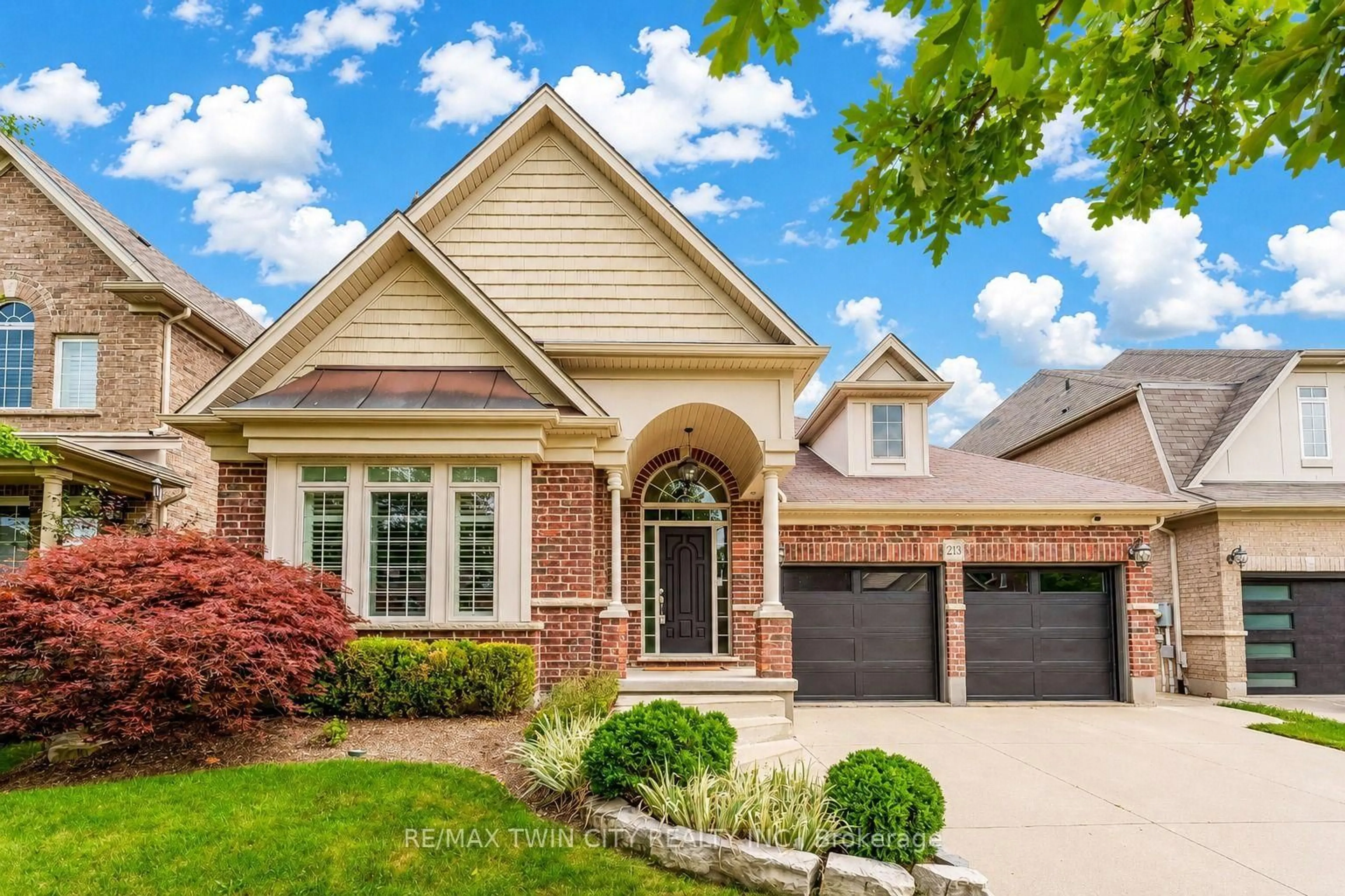 Home with brick exterior material, street for 213 Edgewater Cres, Kitchener Ontario N2A 4M2