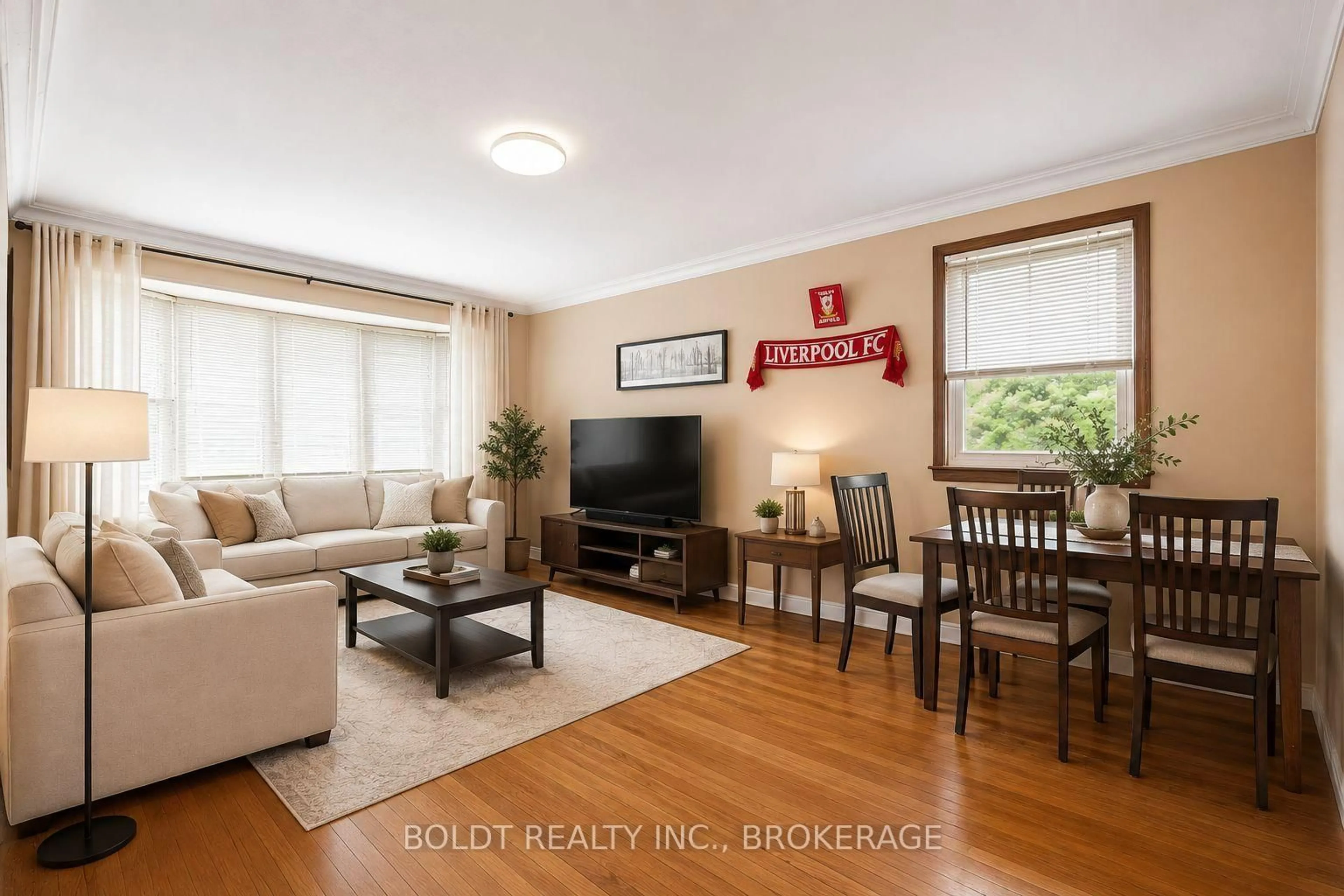 Living room with furniture, wood/laminate floor for 5568 Drummond Rd, Niagara Falls Ontario L2G 4L3