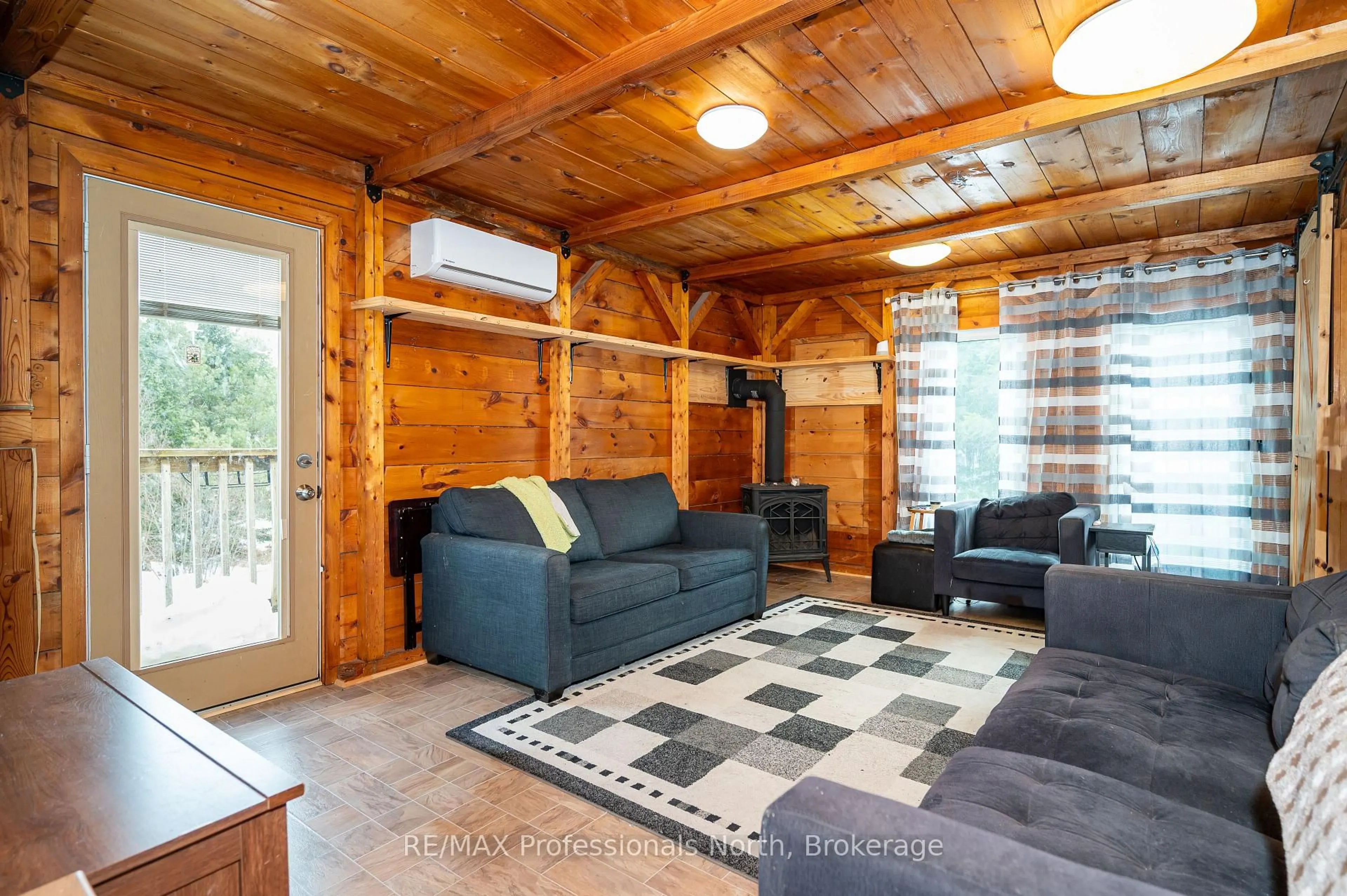 Living room with furniture, wood/laminate floor for 2315 Aspdin Rd, Huntsville Ontario P0B 1M0