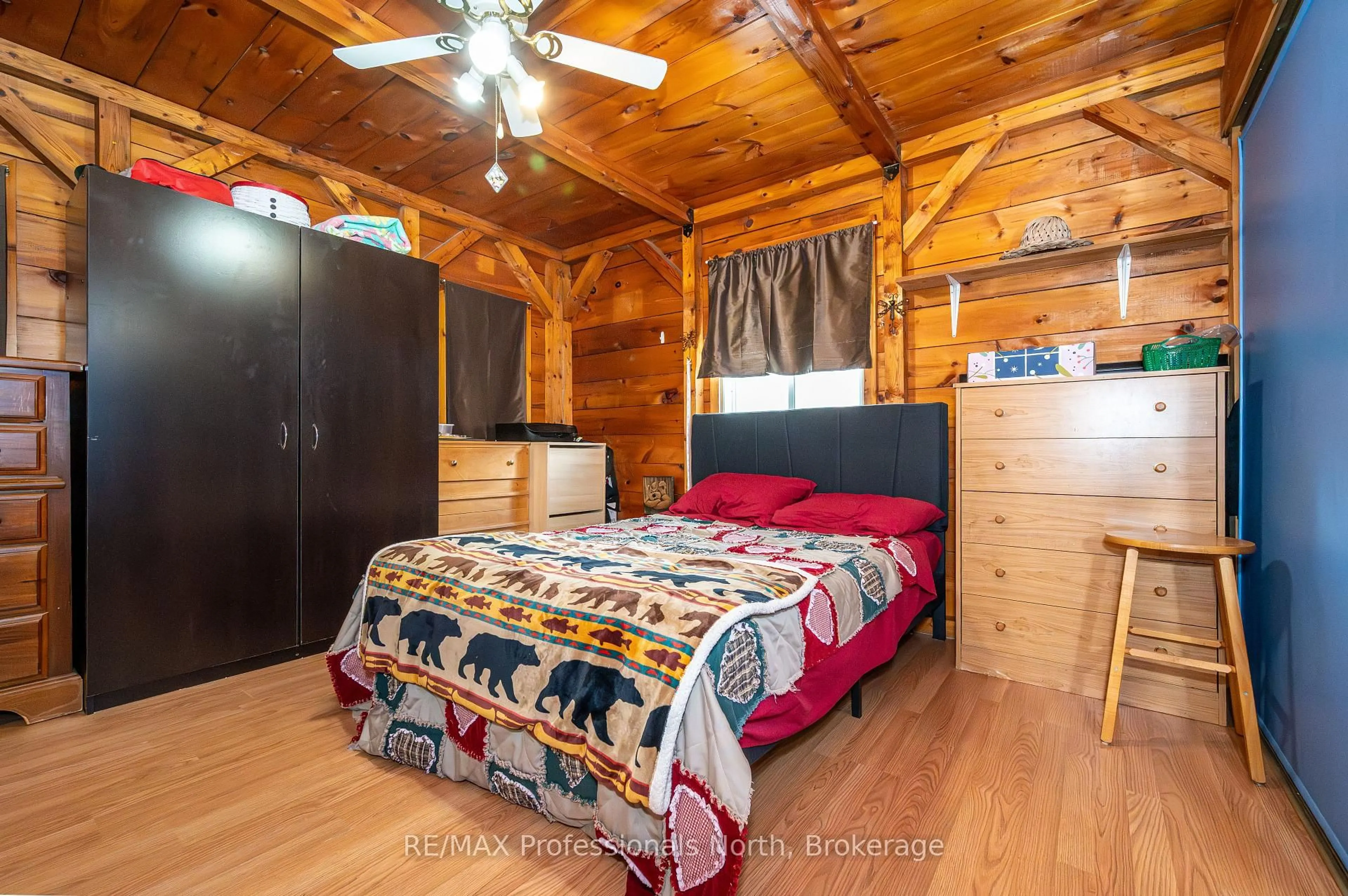 Bedroom with bed, wood/laminate floor for 2315 Aspdin Rd, Huntsville Ontario P0B 1M0