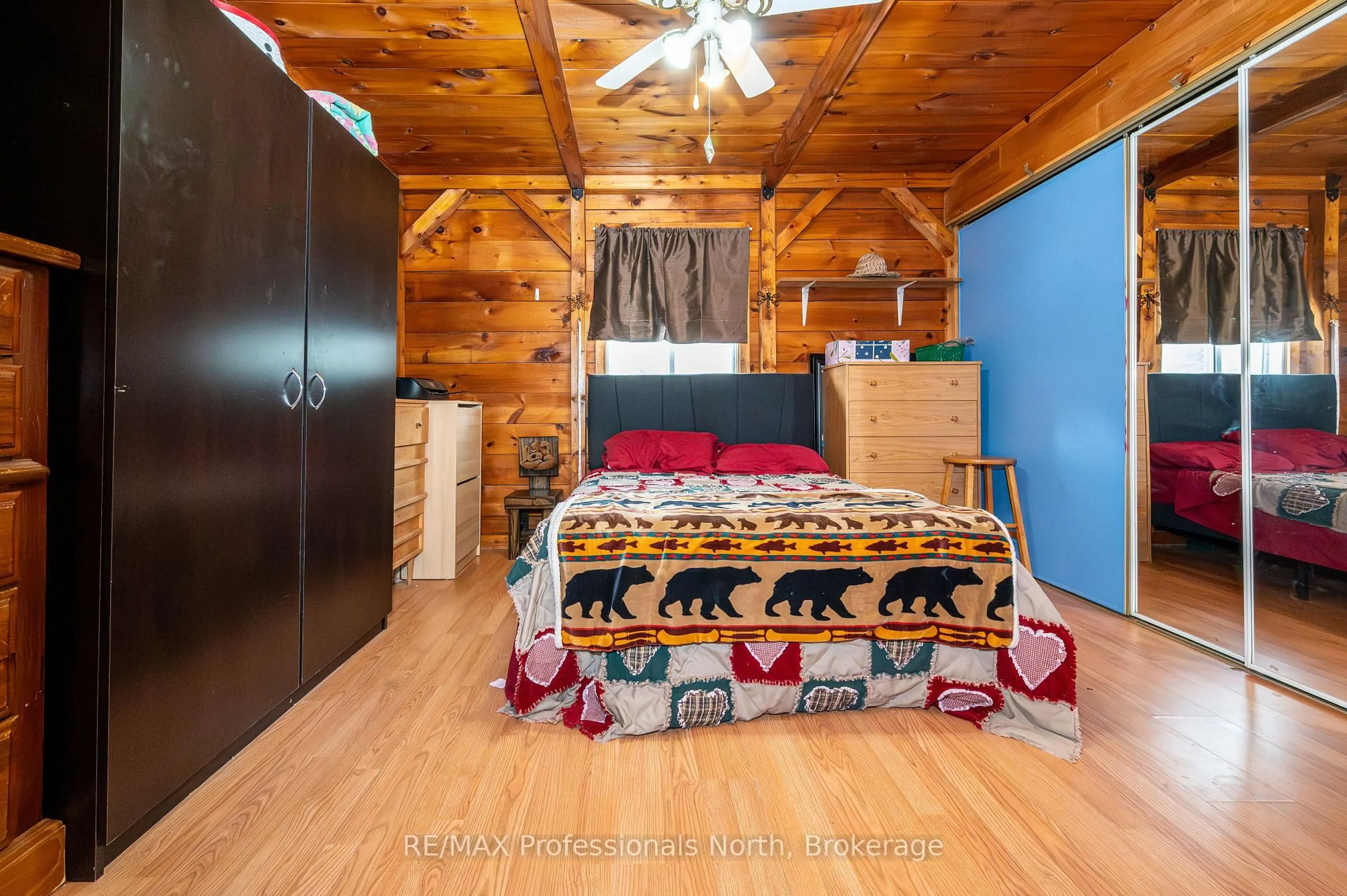 Bedroom with bed, wood/laminate floor for 2315 Aspdin Rd, Huntsville Ontario P0B 1M0