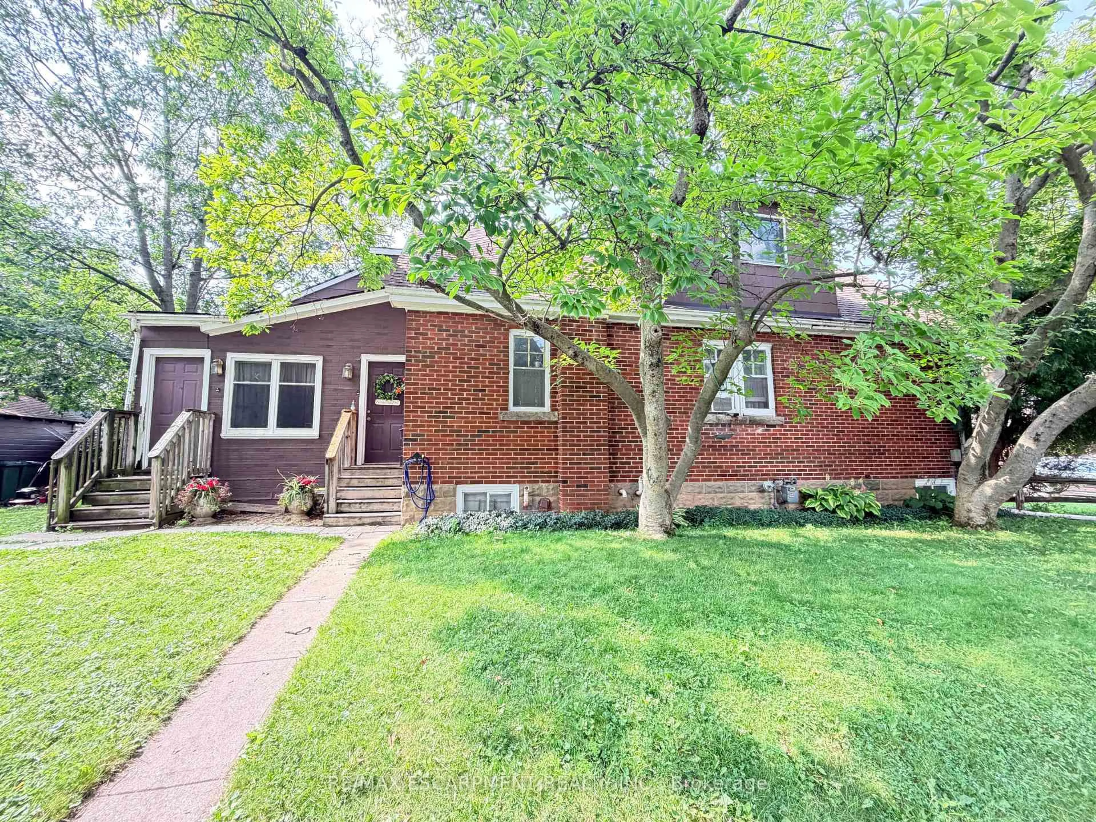 Home with brick exterior material, street for 1 Norwood Rd, Hamilton Ontario L8S 3P8