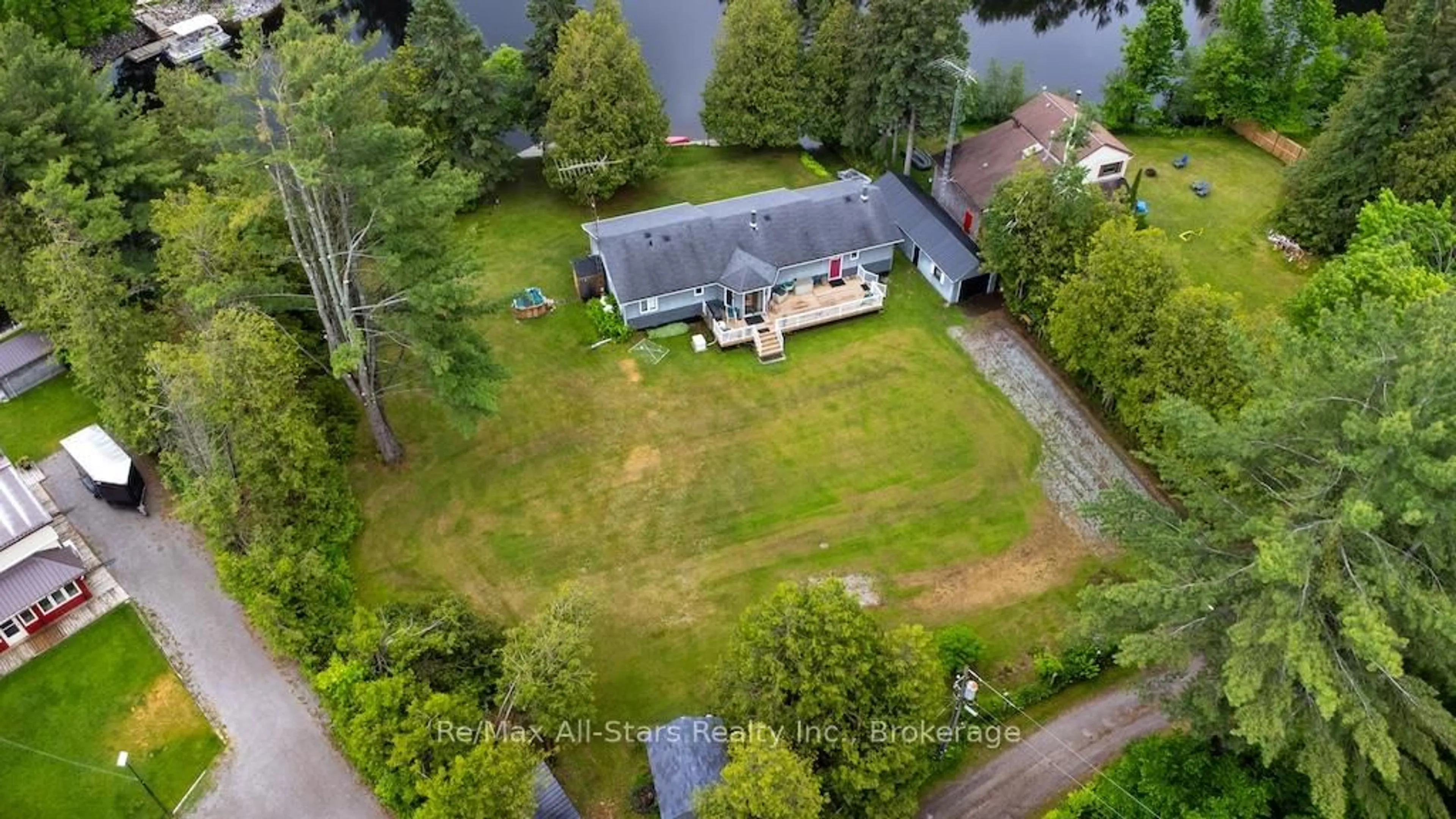 A pic from outside/outdoor area/front of a property/back of a property/a pic from drone, water/lake/river/ocean view for 27 Aspen Dr, Kawartha Lakes Ontario K0M 1N0