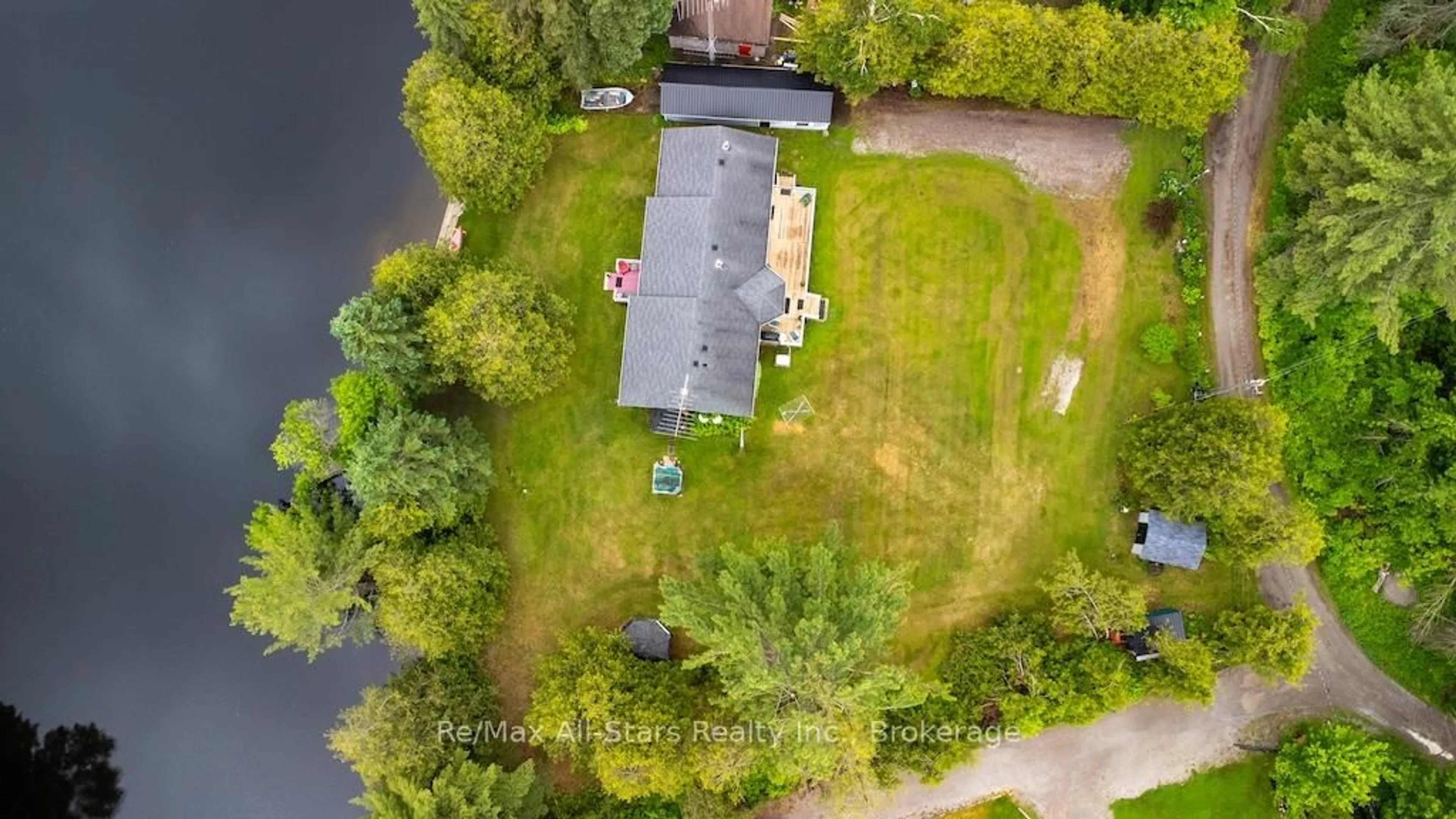 A pic from outside/outdoor area/front of a property/back of a property/a pic from drone, water/lake/river/ocean view for 27 Aspen Dr, Kawartha Lakes Ontario K0M 1N0