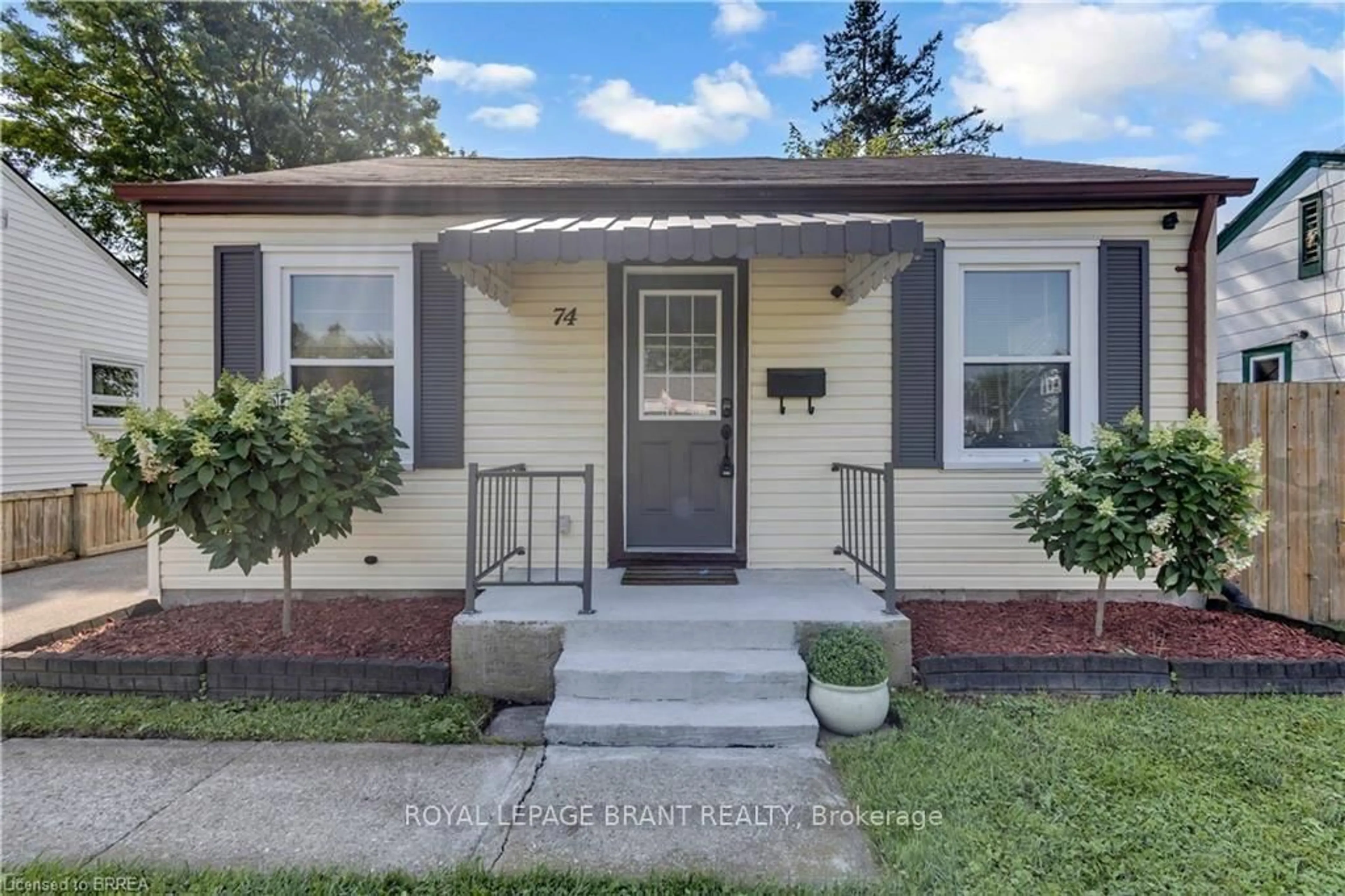 Home with vinyl exterior material, street for 74 Eighth Ave, Brantford Ontario N3S 1C5