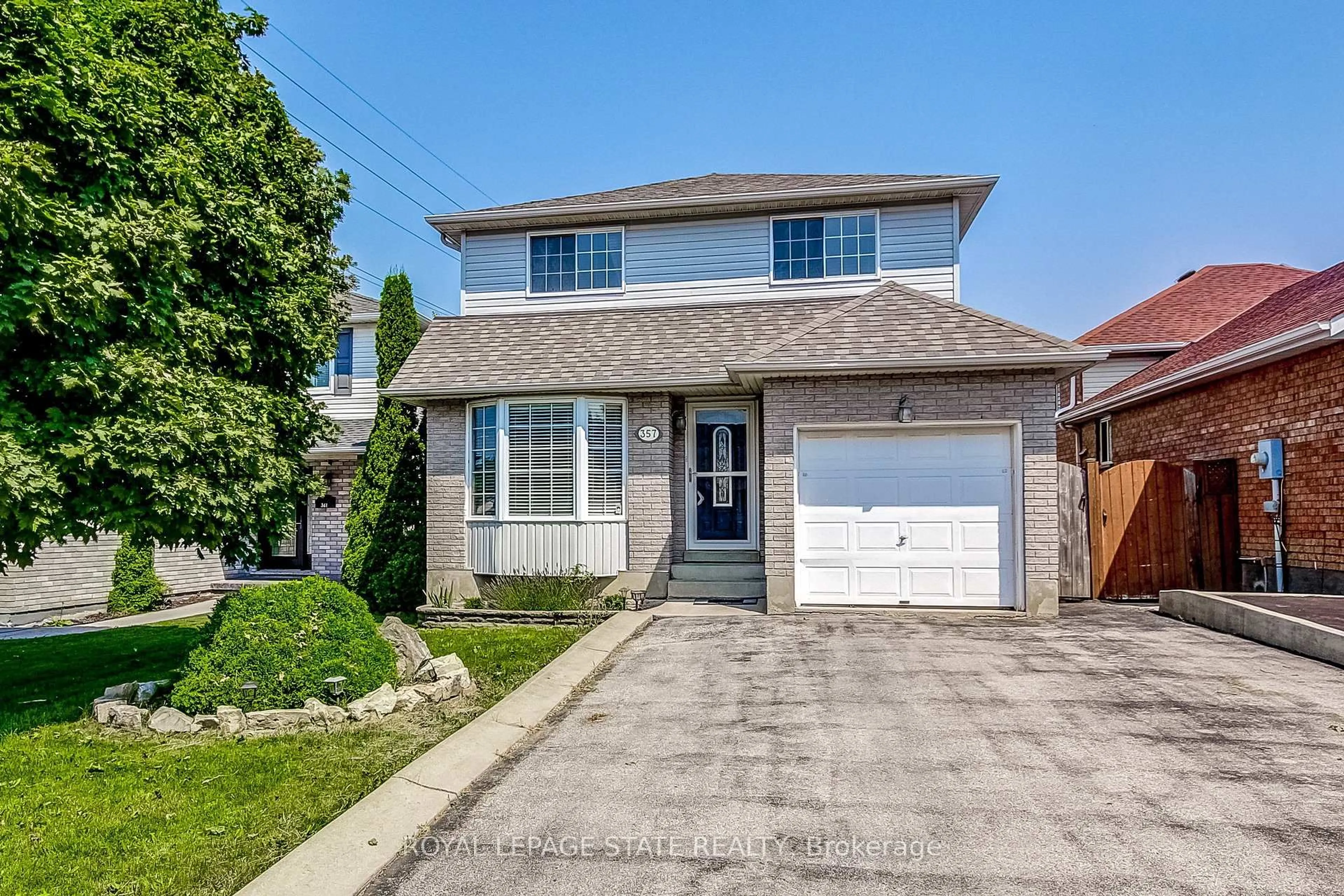 Home with brick exterior material, street for 357 Acadia Dr, Hamilton Ontario L8W 3L7