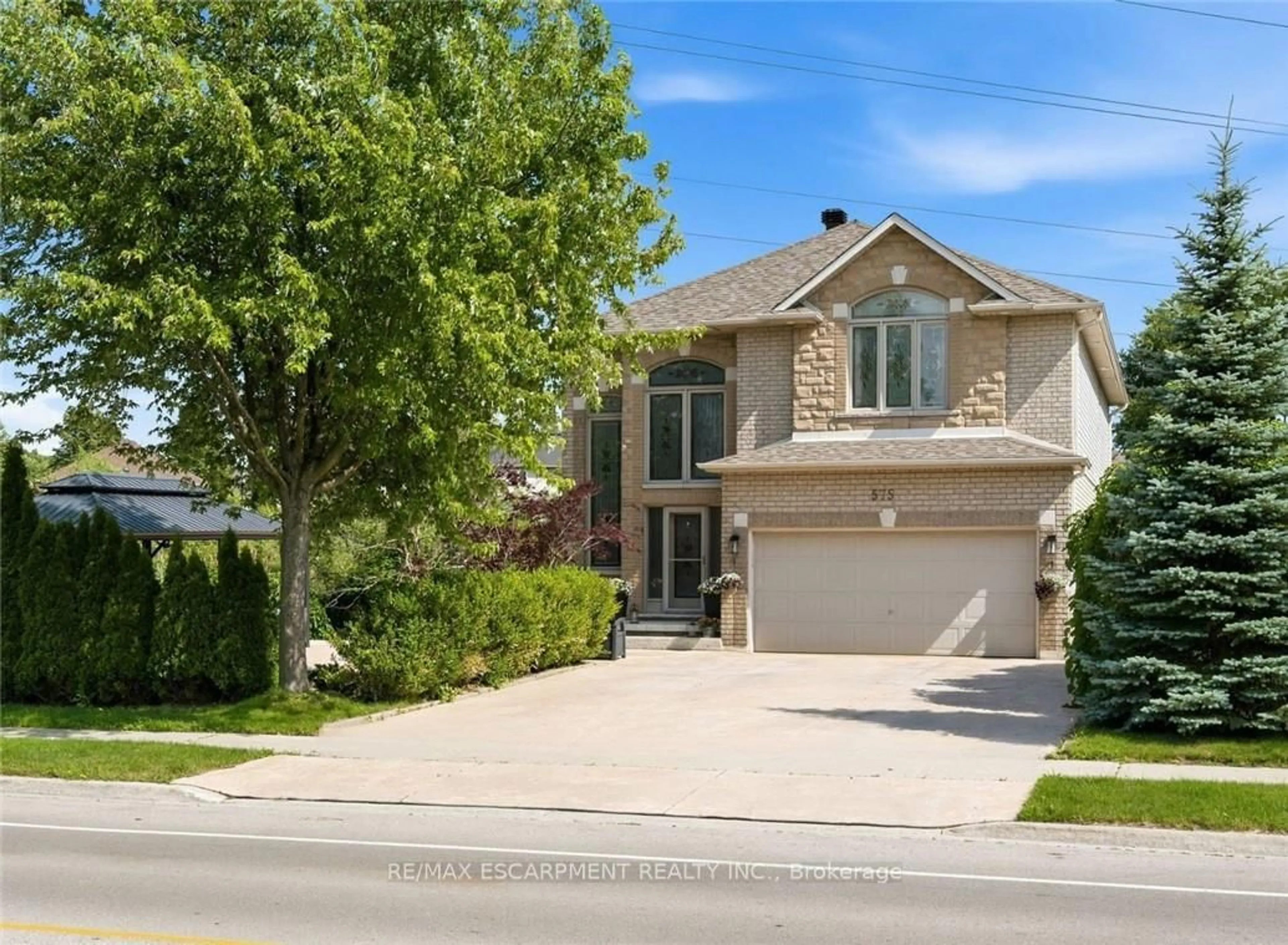 Home with brick exterior material, street for 575 Stonehenge Dr, Hamilton Ontario L9K 1T4