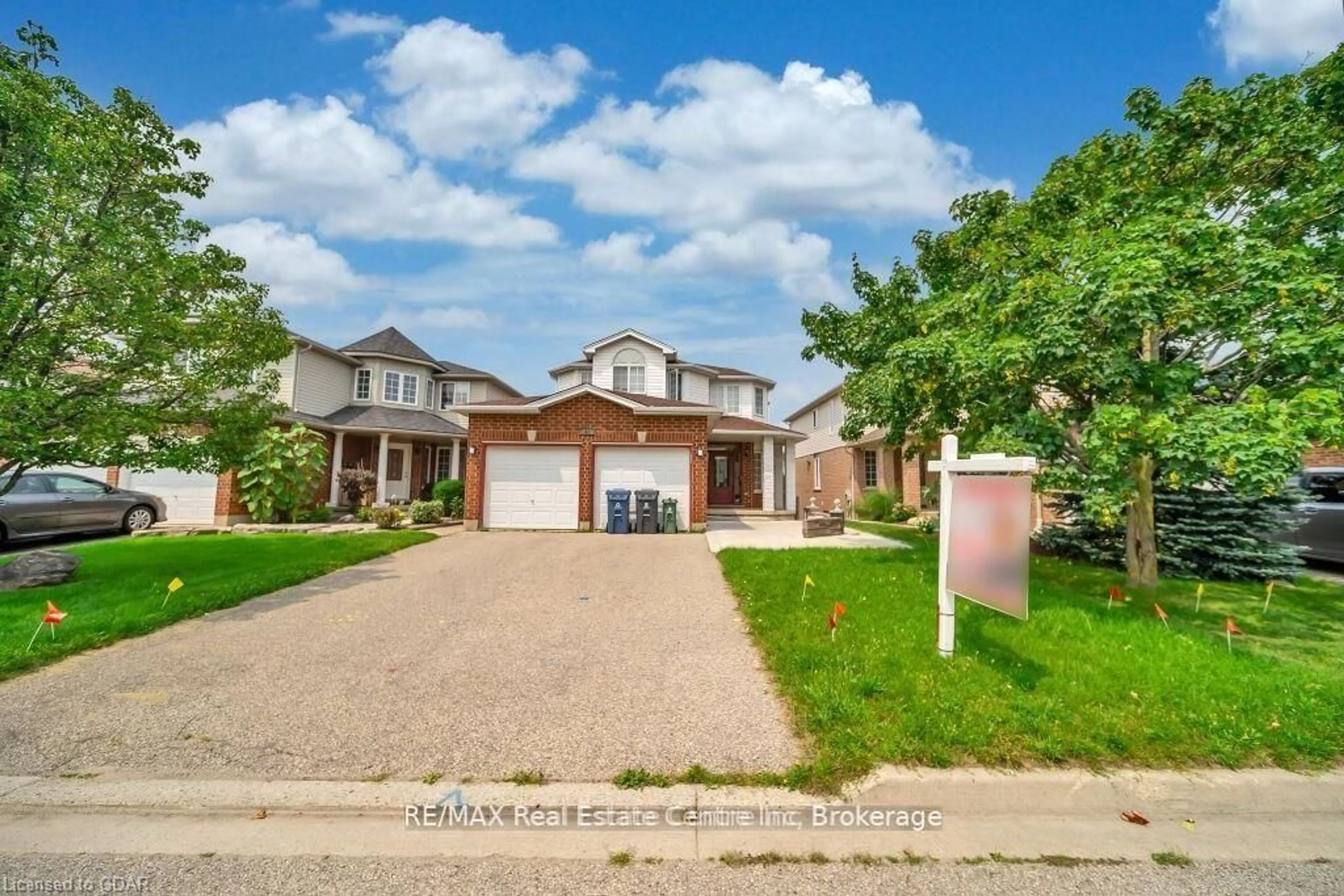 Home with brick exterior material, street for 61 MOFFATT Lane, Guelph Ontario N1G 5E8
