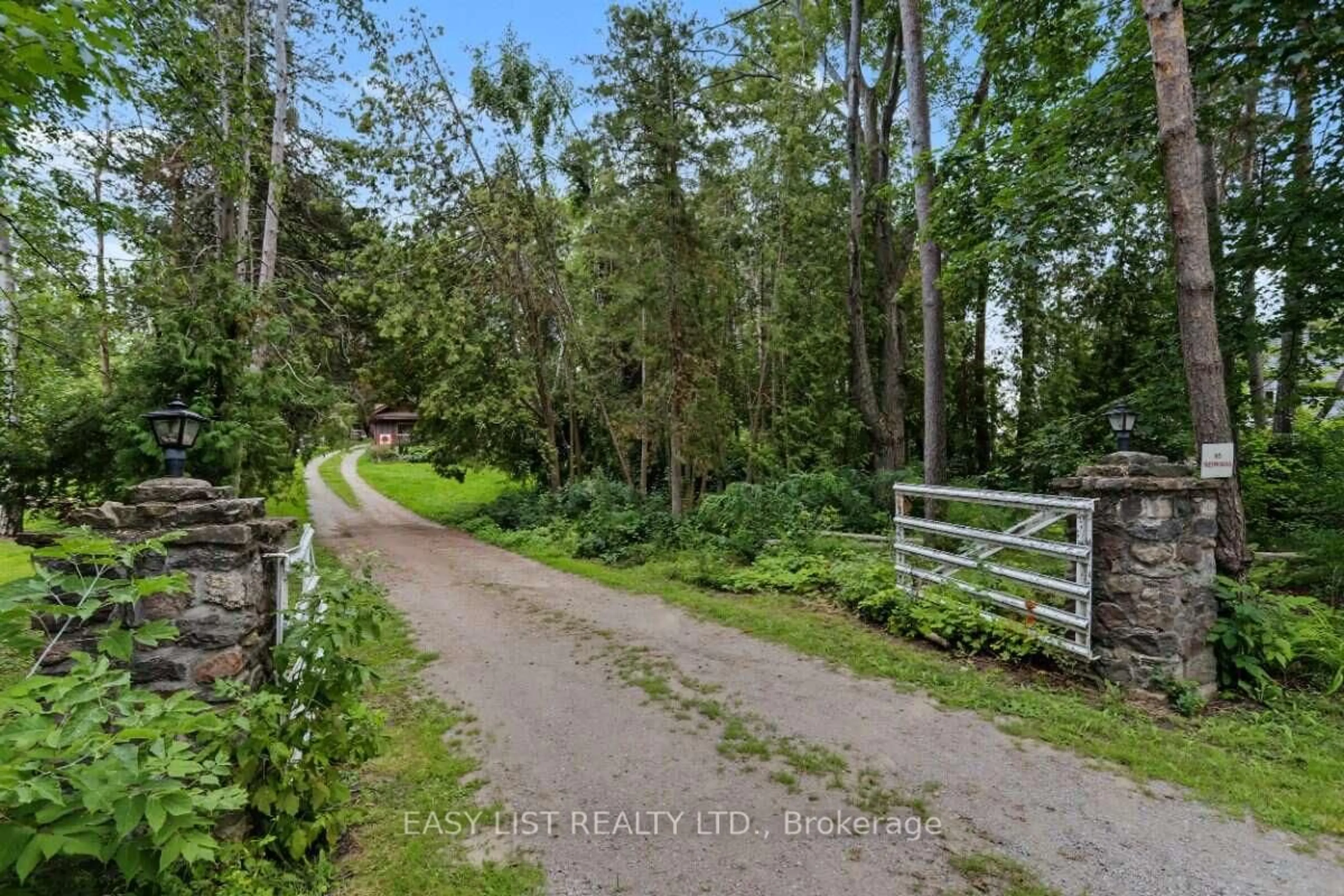 A pic from outside/outdoor area/front of a property/back of a property/a pic from drone, forest/trees view for 51 Leslie Frost Lane, Kawartha Lakes Ontario K9V 4R6