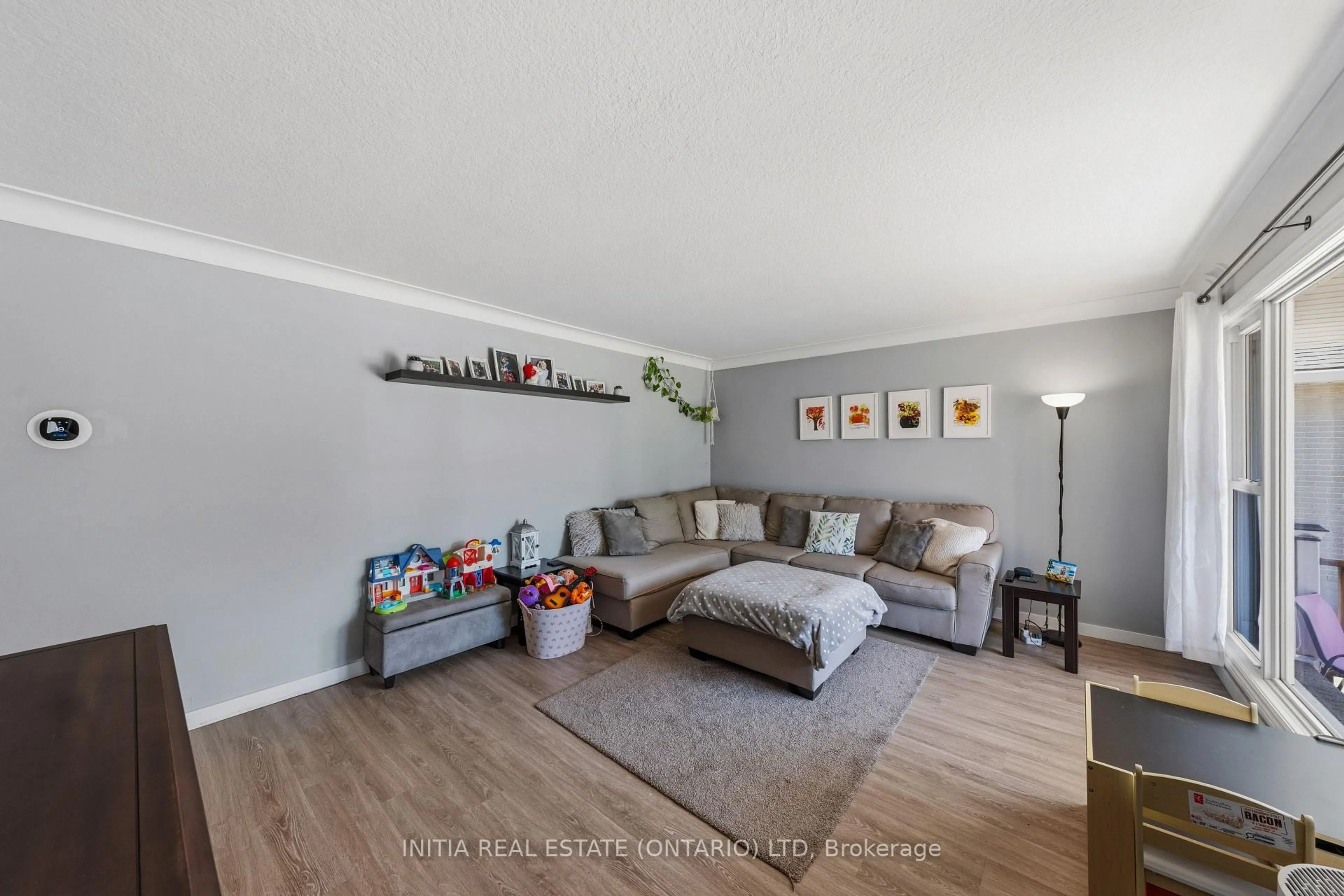 Living room with furniture, wood/laminate floor for 97 Grey Cres, Sarnia Ontario N7S 2S3