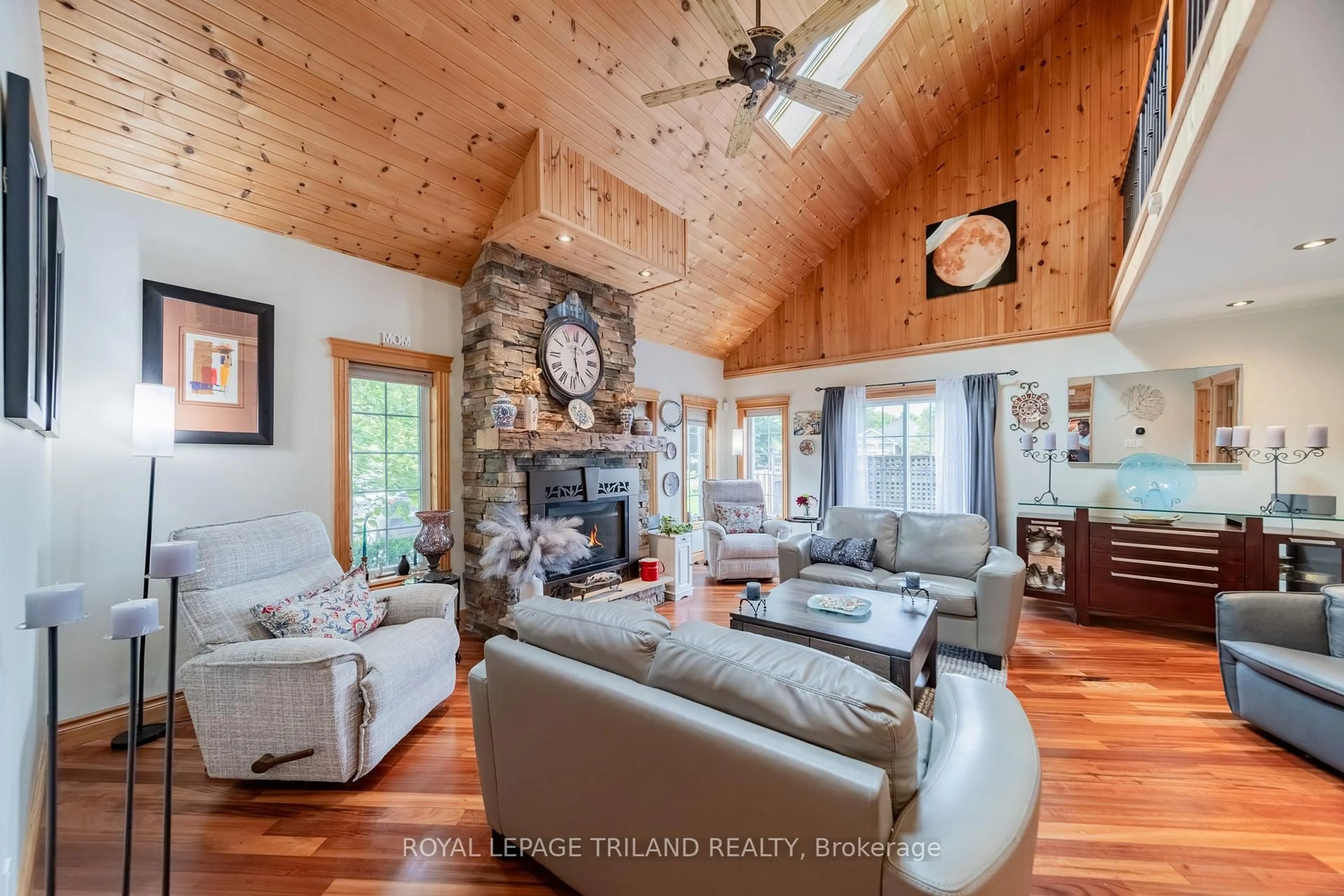 Living room with furniture, wood/laminate floor for 71246 Sandra St, Bluewater Ontario N0M 1N0
