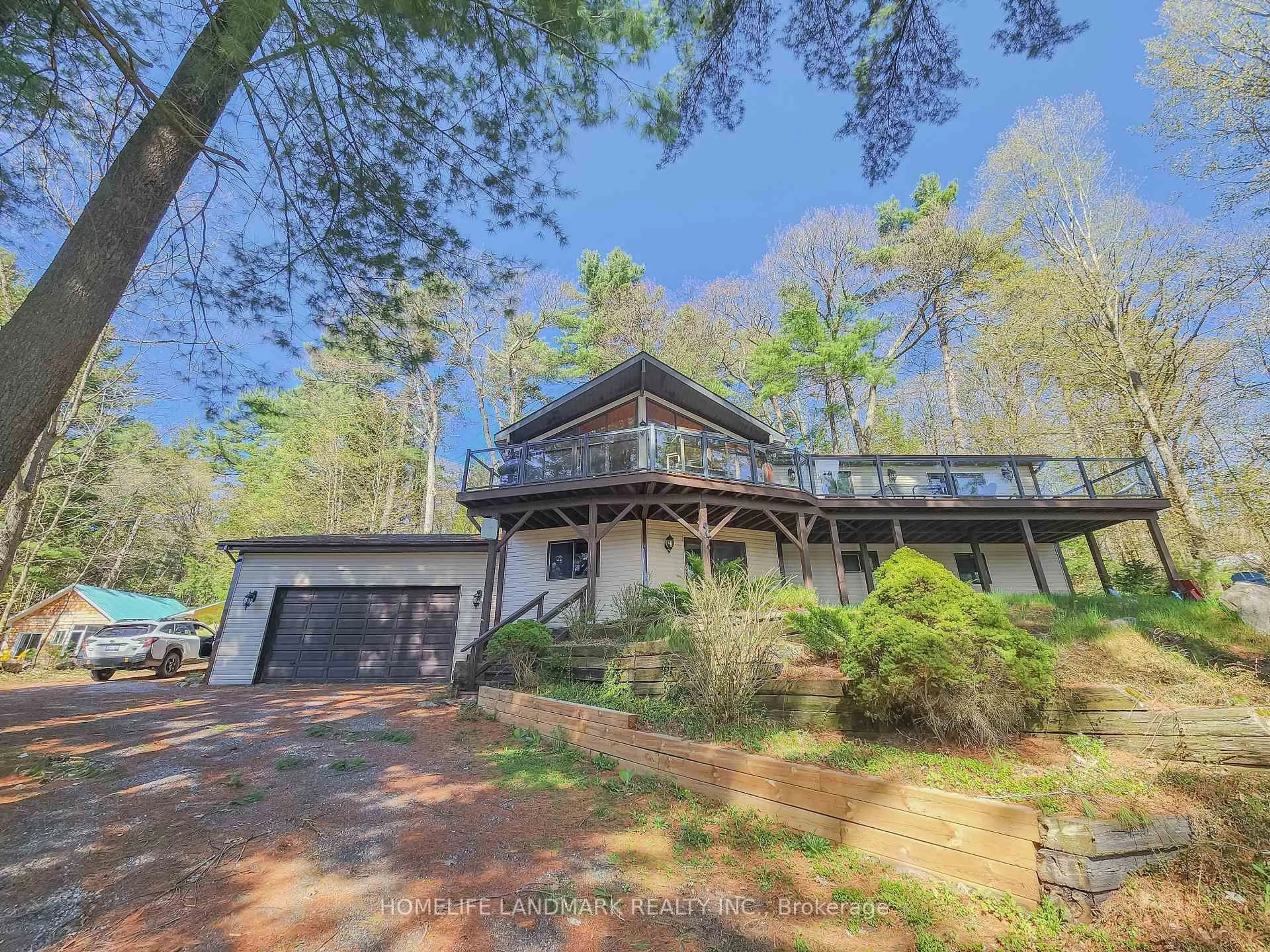 A pic from outside/outdoor area/front of a property/back of a property/a pic from drone, forest/trees view for 1245 Mortimers Point Rd, Muskoka Lakes Ontario P0B 1J0