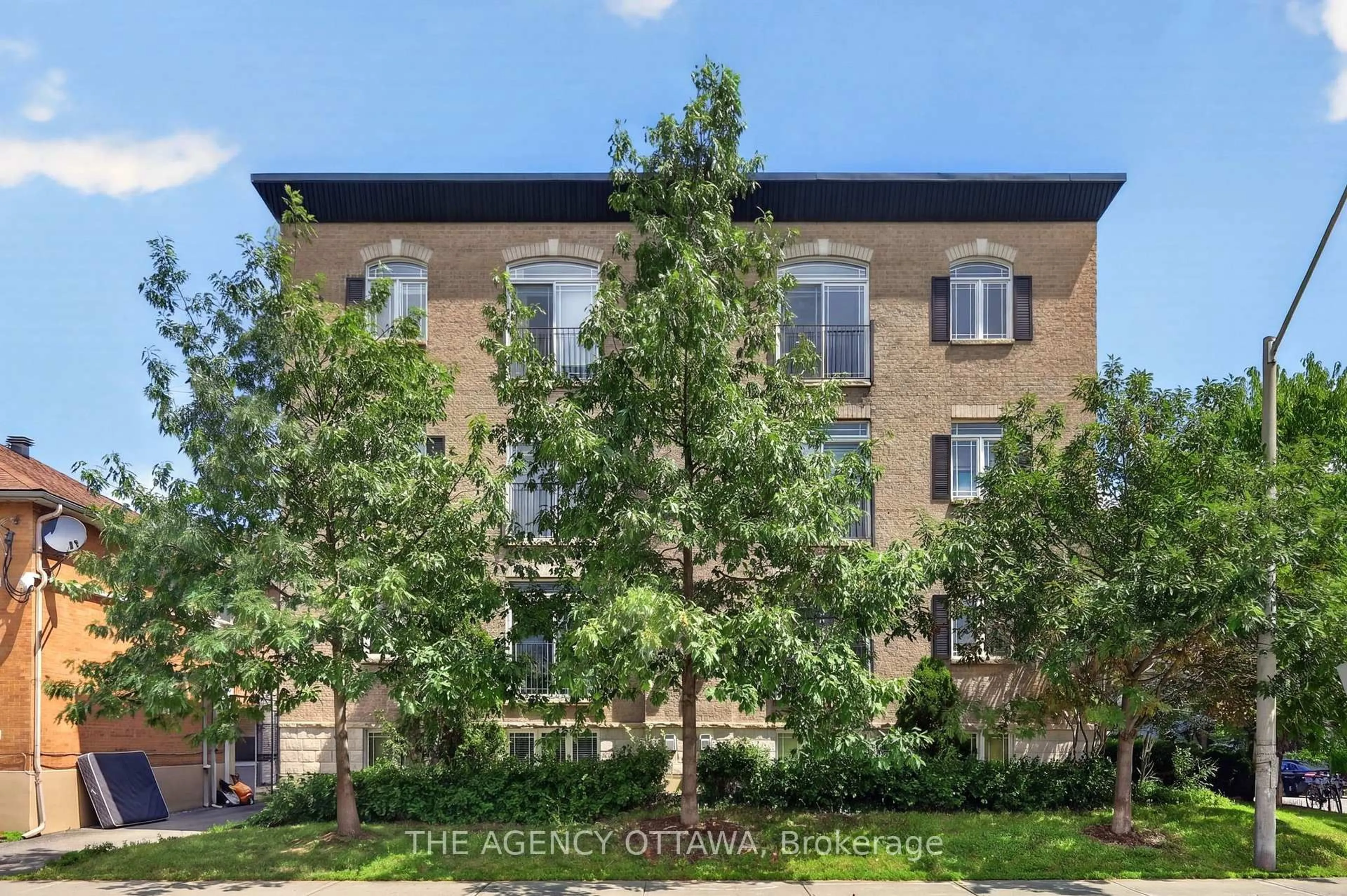 A pic from outside/outdoor area/front of a property/back of a property/a pic from drone, street for 711 Churchill Ave #203, Ottawa Ontario K1Z 7J9