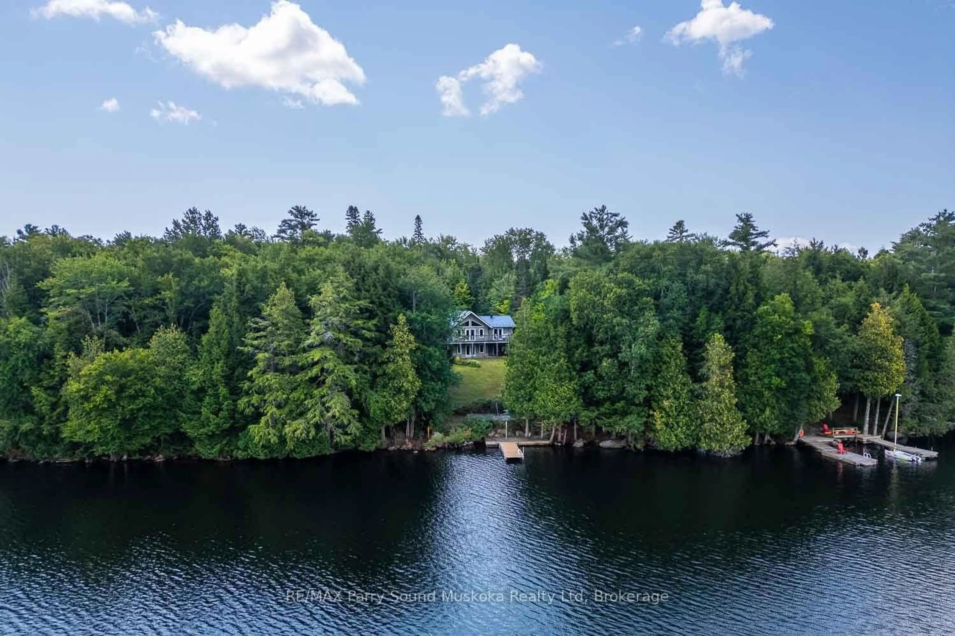 A pic from outside/outdoor area/front of a property/back of a property/a pic from drone, water/lake/river/ocean view for 1889 South Horn Lake Rd, Magnetawan Ontario P0A 1P0