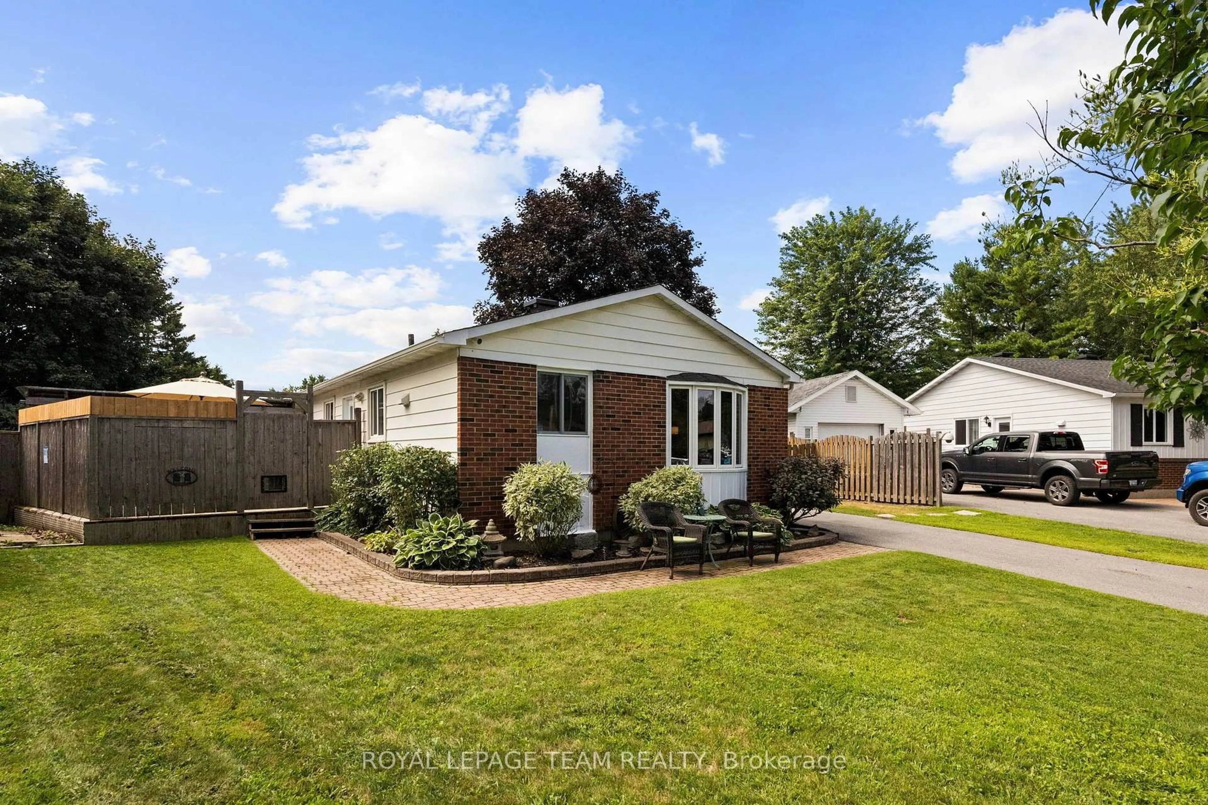 Home with vinyl exterior material, street for 27 Ballantrae Way, Ottawa Ontario K2L 1N3
