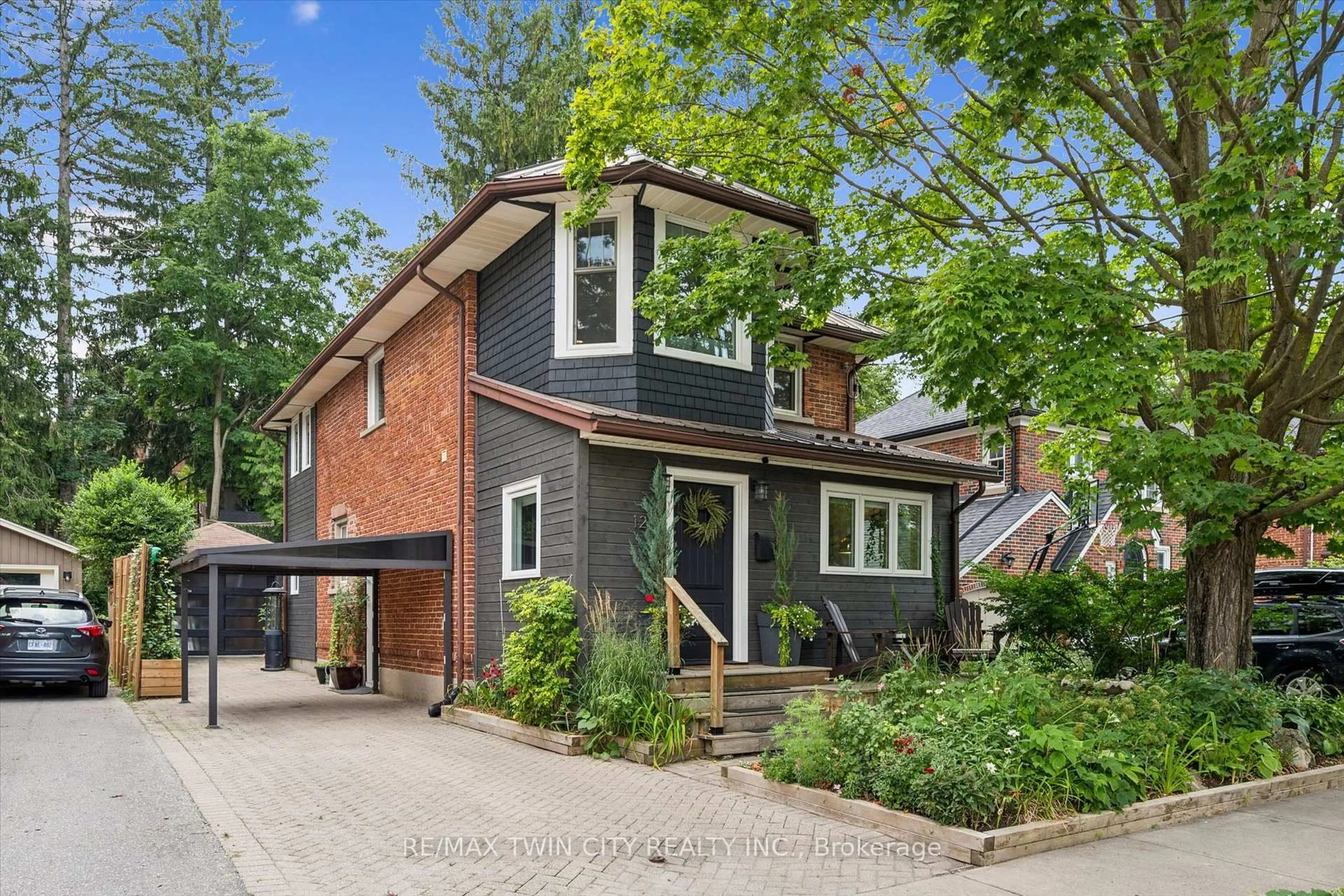 Home with brick exterior material, street for 121 Belmont Ave, Waterloo Ontario N2L 2A8