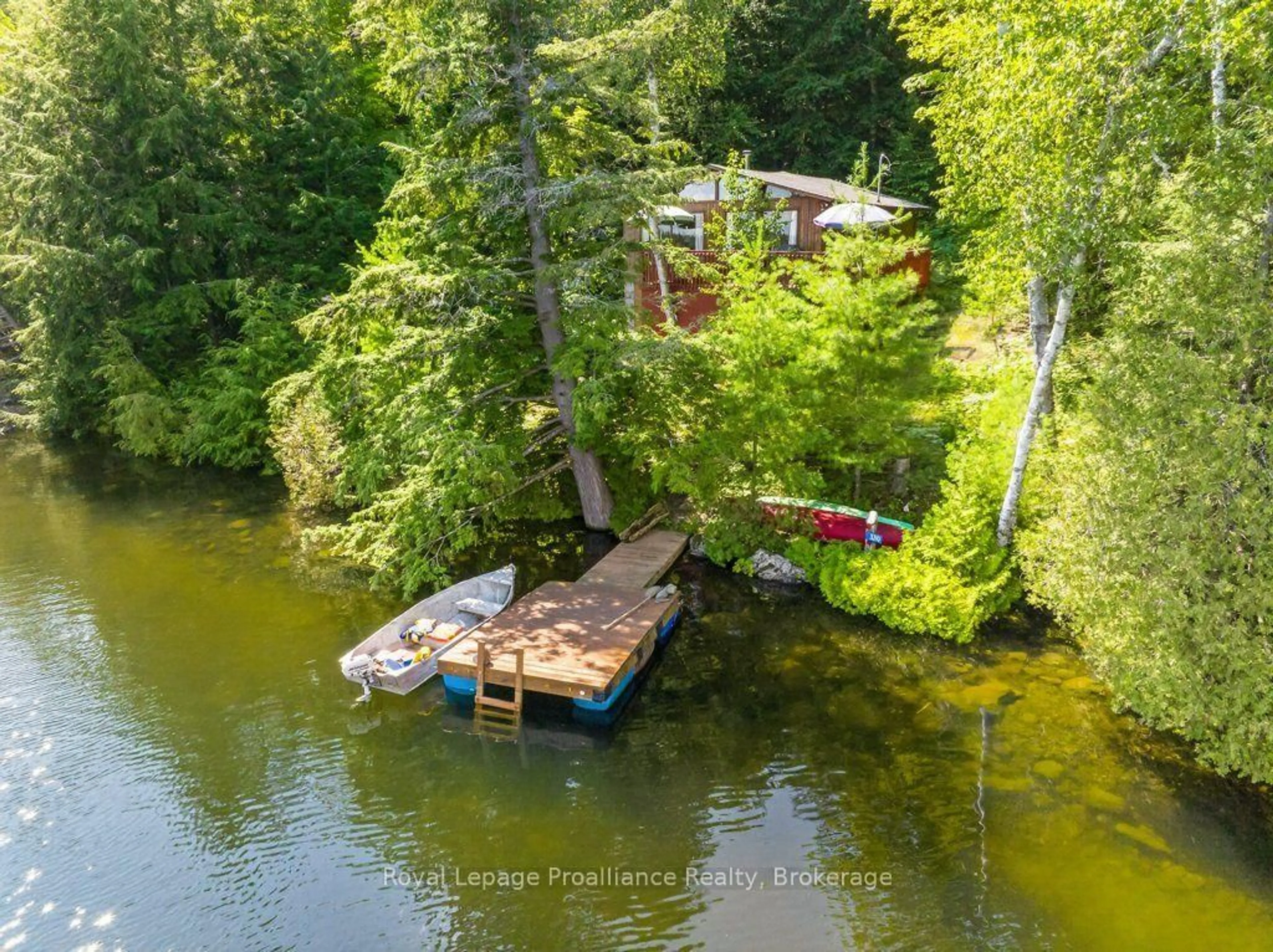 A pic from outside/outdoor area/front of a property/back of a property/a pic from drone, water/lake/river/ocean view for 3310 Shabomeka Lake, Cloyne Ontario K0H 1K0