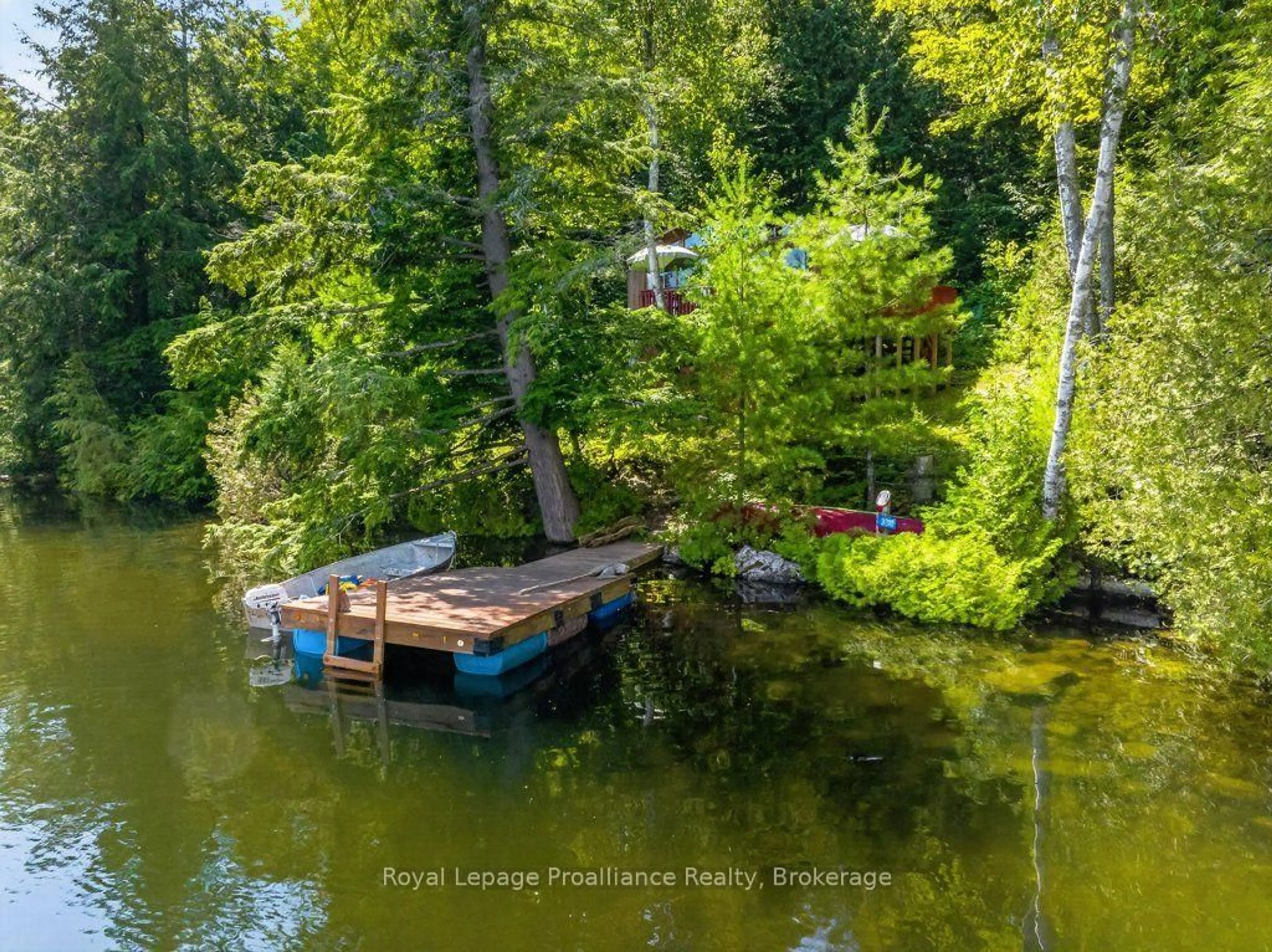 A pic from outside/outdoor area/front of a property/back of a property/a pic from drone, water/lake/river/ocean view for 3310 Shabomeka Lake, Cloyne Ontario K0H 1K0