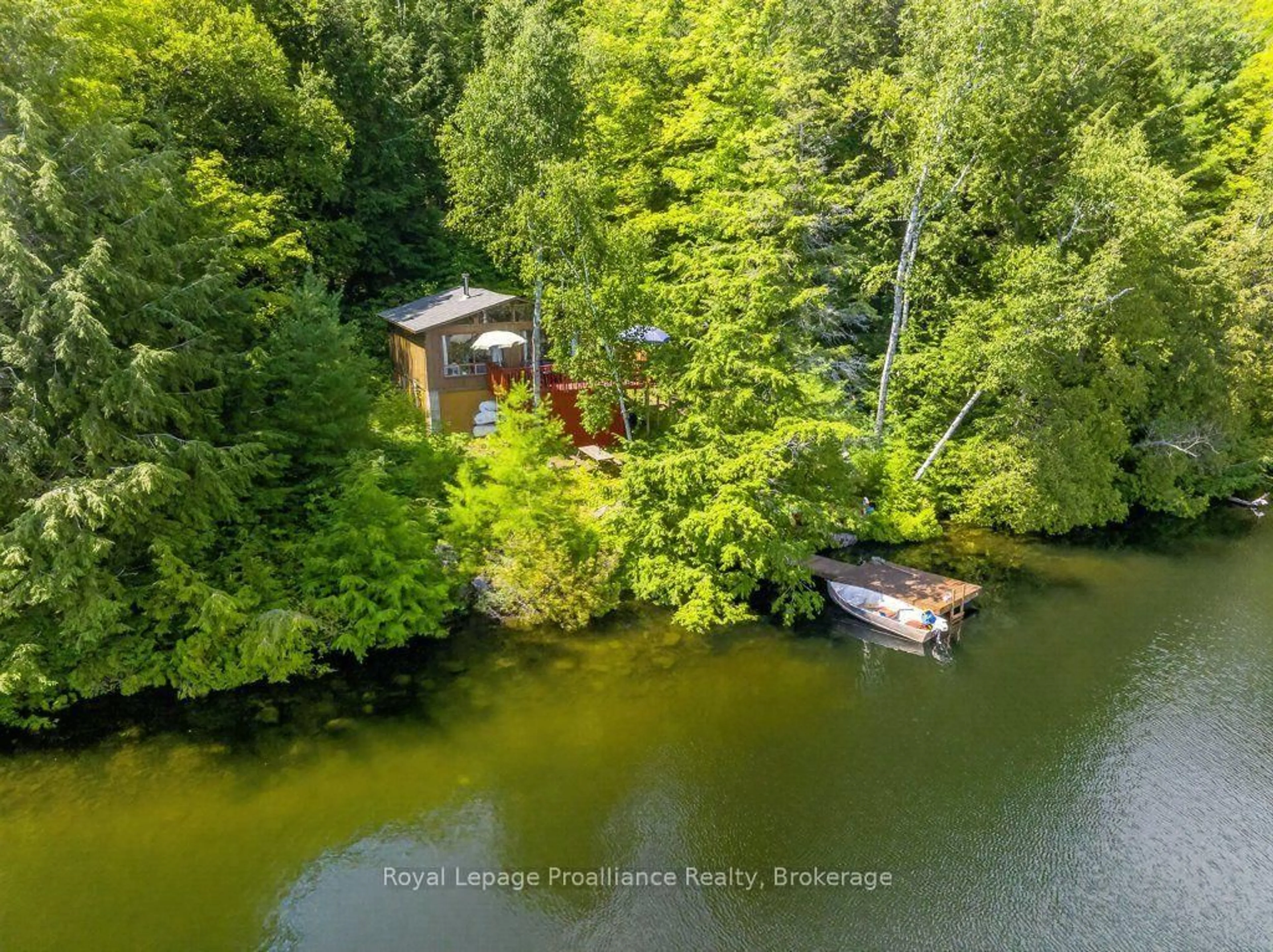 A pic from outside/outdoor area/front of a property/back of a property/a pic from drone, water/lake/river/ocean view for 3310 Shabomeka Lake, Cloyne Ontario K0H 1K0