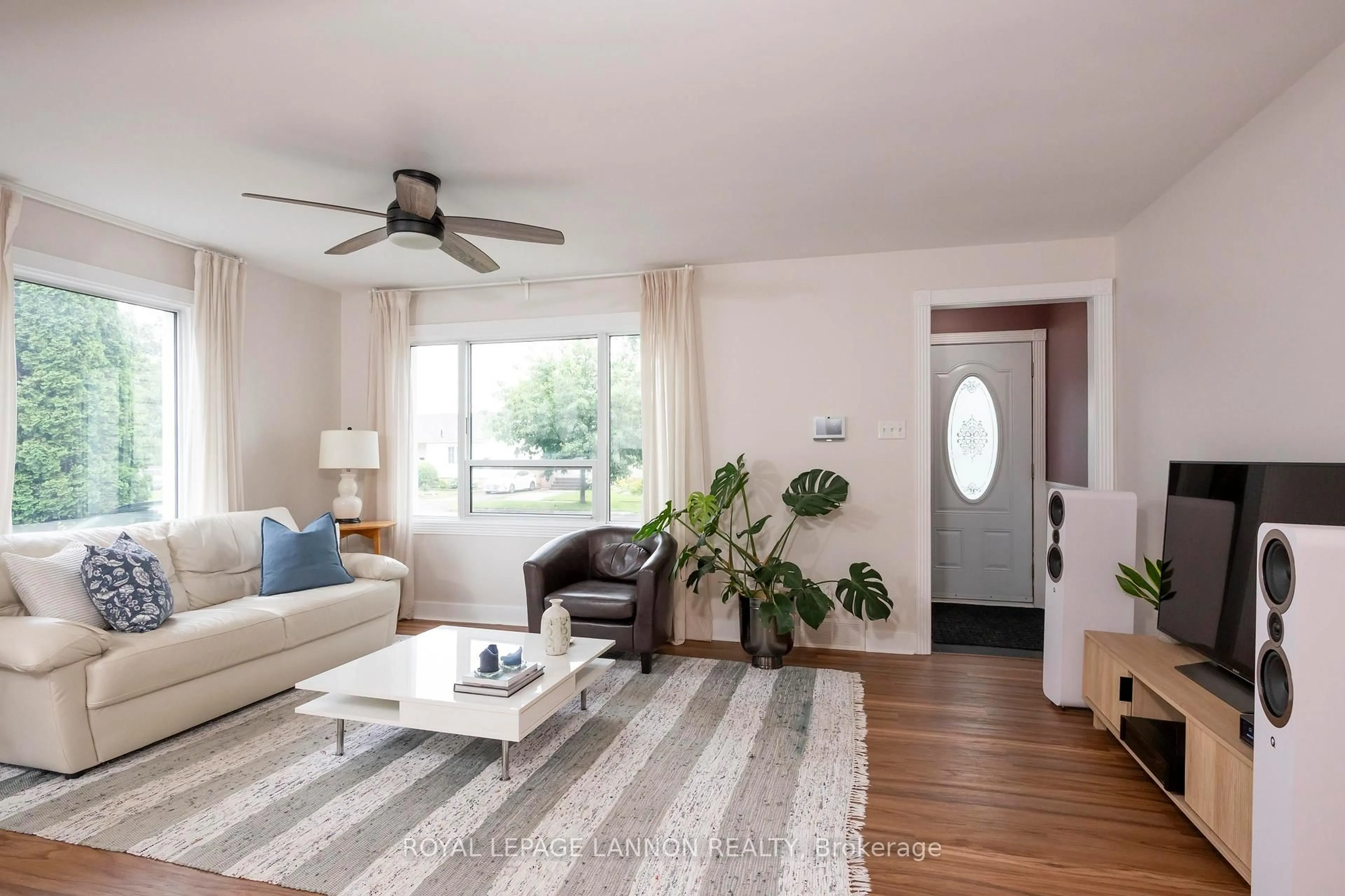 Living room with furniture, wood/laminate floor for 2035 Hamilton Ave, Thunder Bay Ontario P7E 4Y3