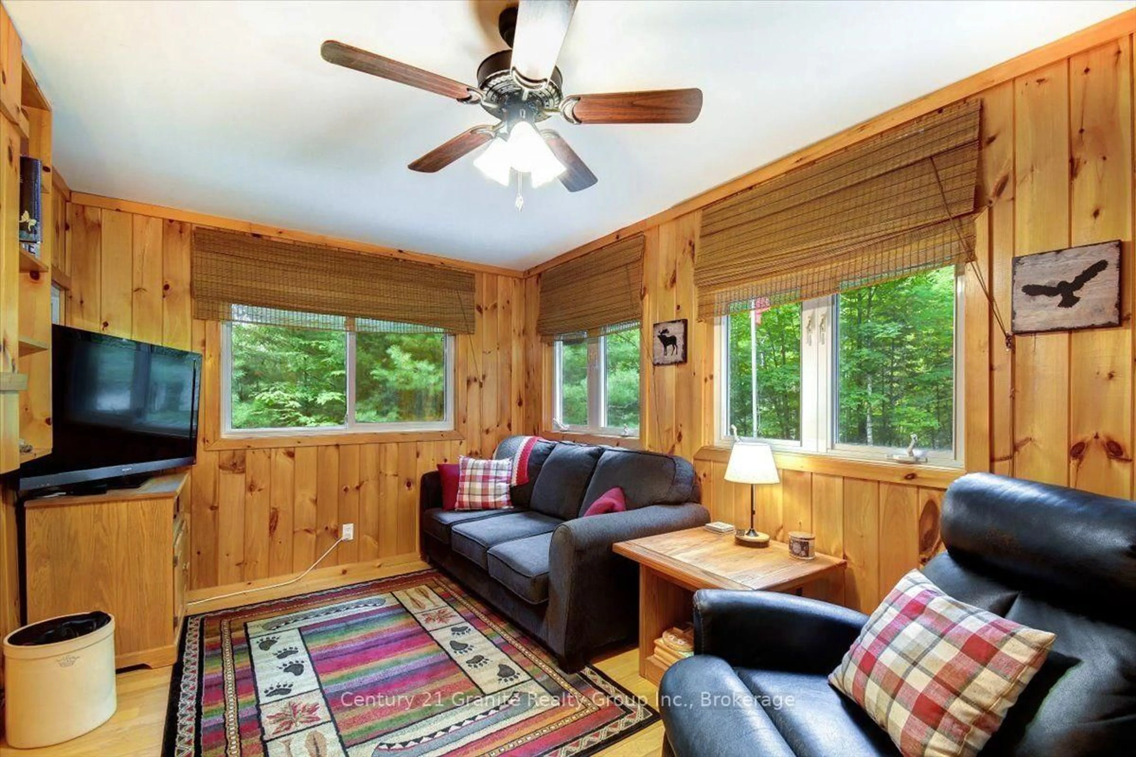 Living room with furniture, wood/laminate floor for 118 Bay Lake Rd, Bancroft Ontario K0L 1C0