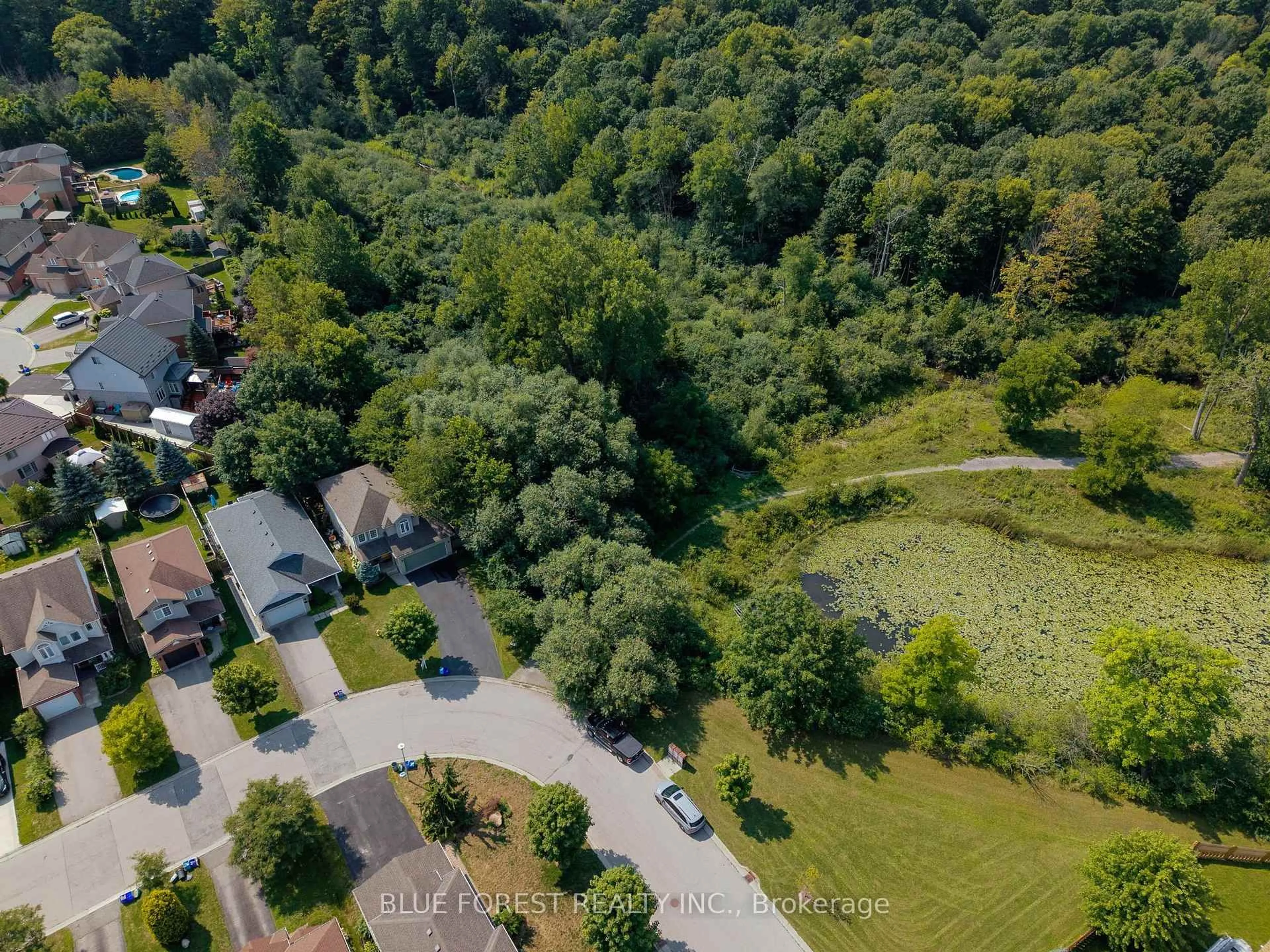 A pic from outside/outdoor area/front of a property/back of a property/a pic from drone, forest/trees view for 1233 Crosscreek Cres, London East Ontario N5Y 6H6