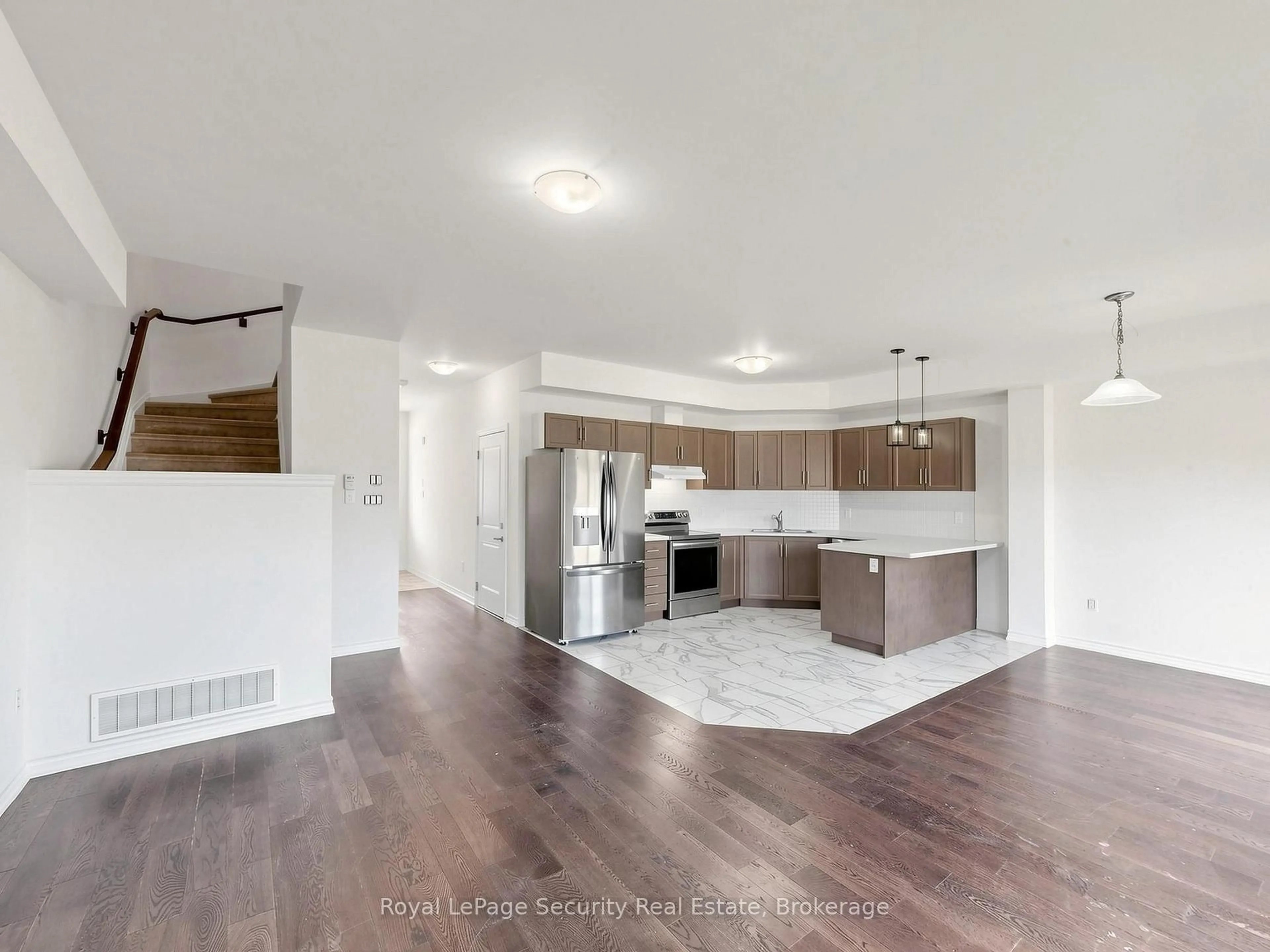 Open concept kitchen, wood/laminate floor for 103 Addison St #31, Blue Mountains Ontario N0H 1J0