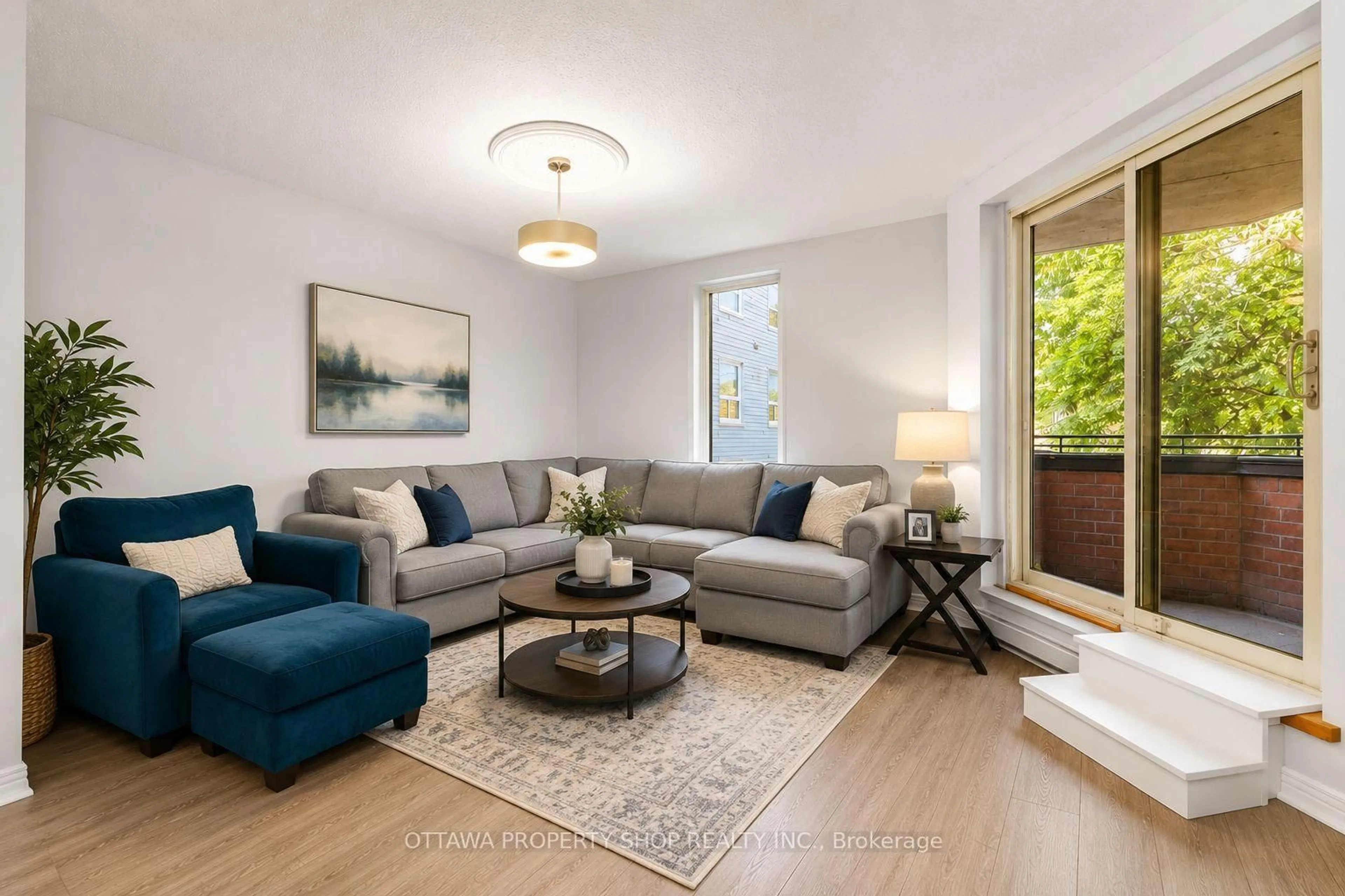 Living room with furniture, wood/laminate floor for 800 Mckellar Ave #204, Ottawa Ontario K2A 2X5