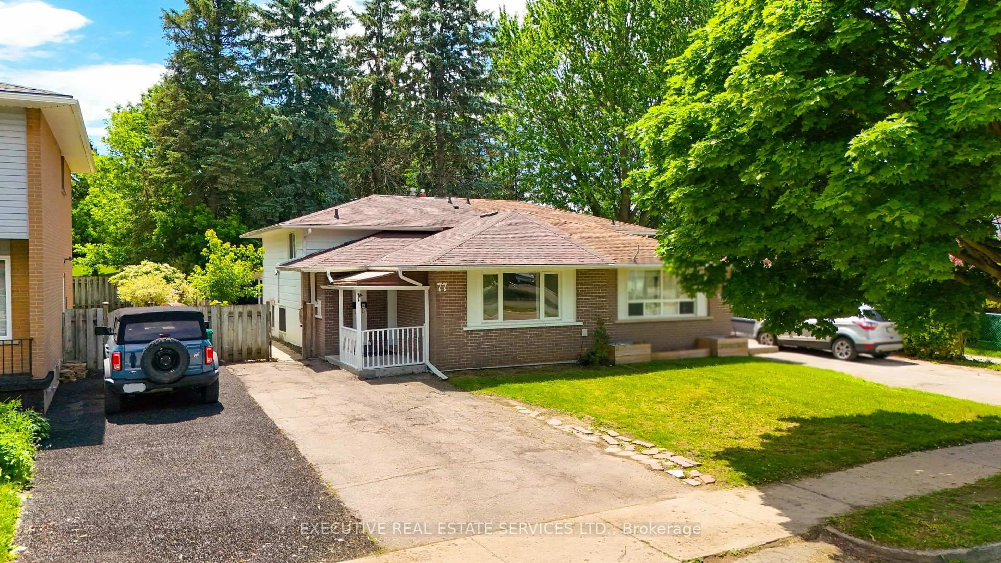 Home with vinyl exterior material, street for 77 Overlea Dr, Kitchener Ontario N2M 1S9
